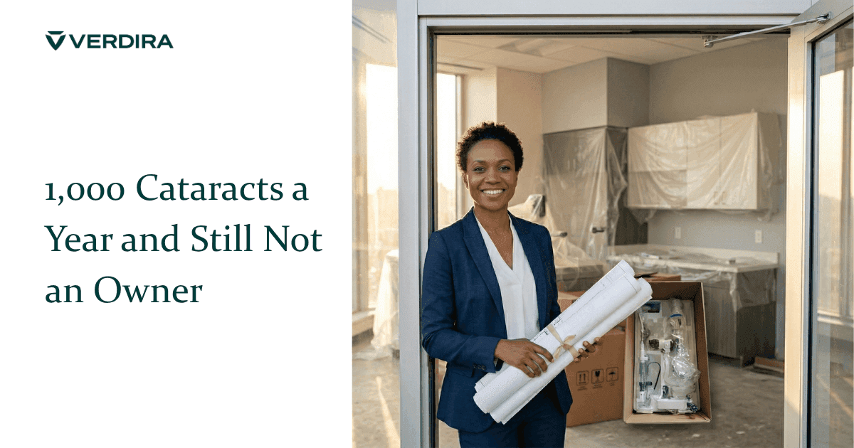 African American female ophthalmologist in business attire standing in doorway of her new practice under construction holding blueprints with ophthalmology equipment in shipping crate