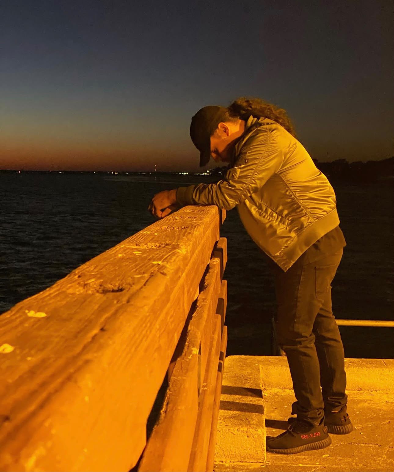 Alone on the pier at dusk