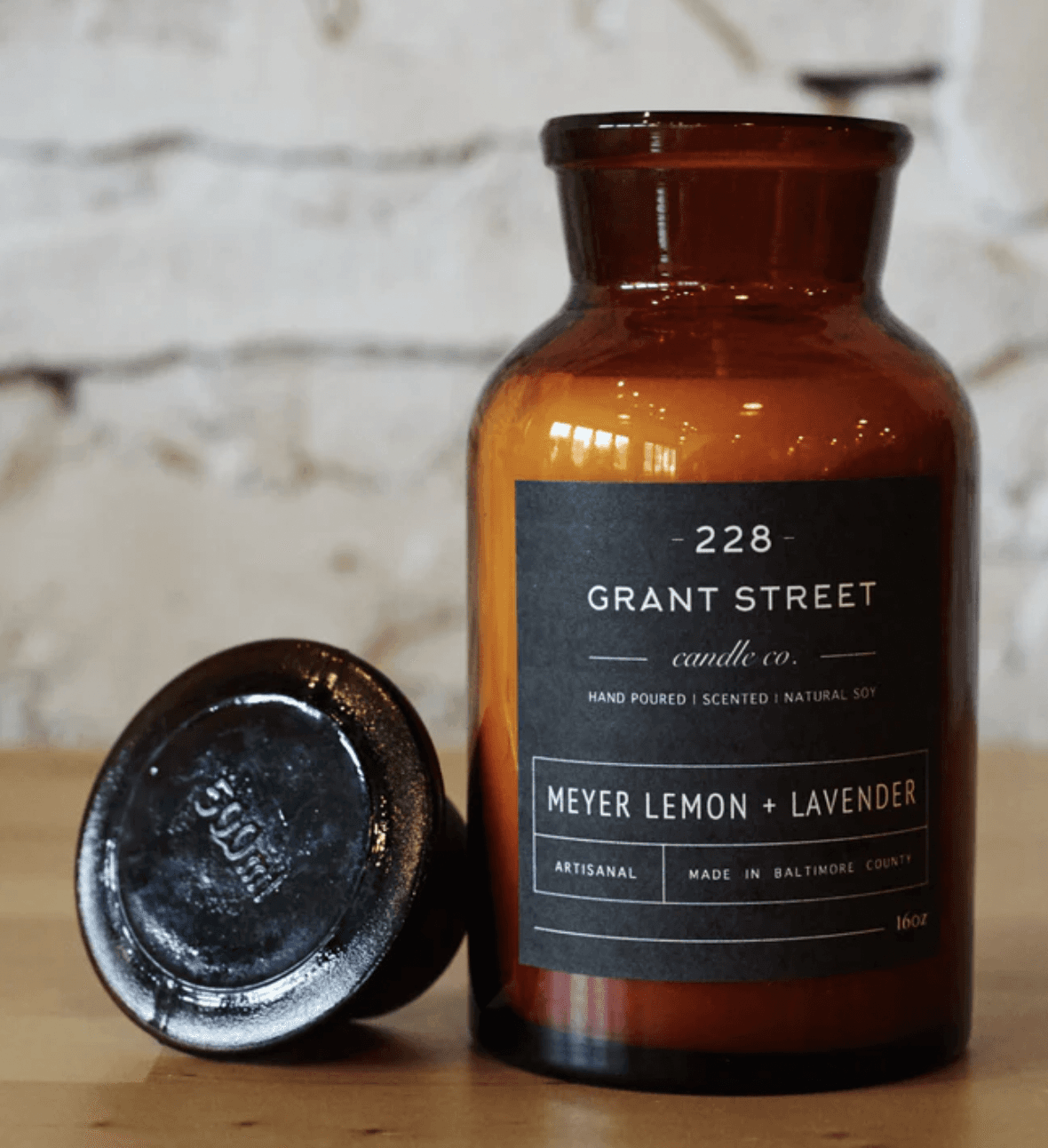 meyer lemon + lavender candle in a brown jar with minimalist design