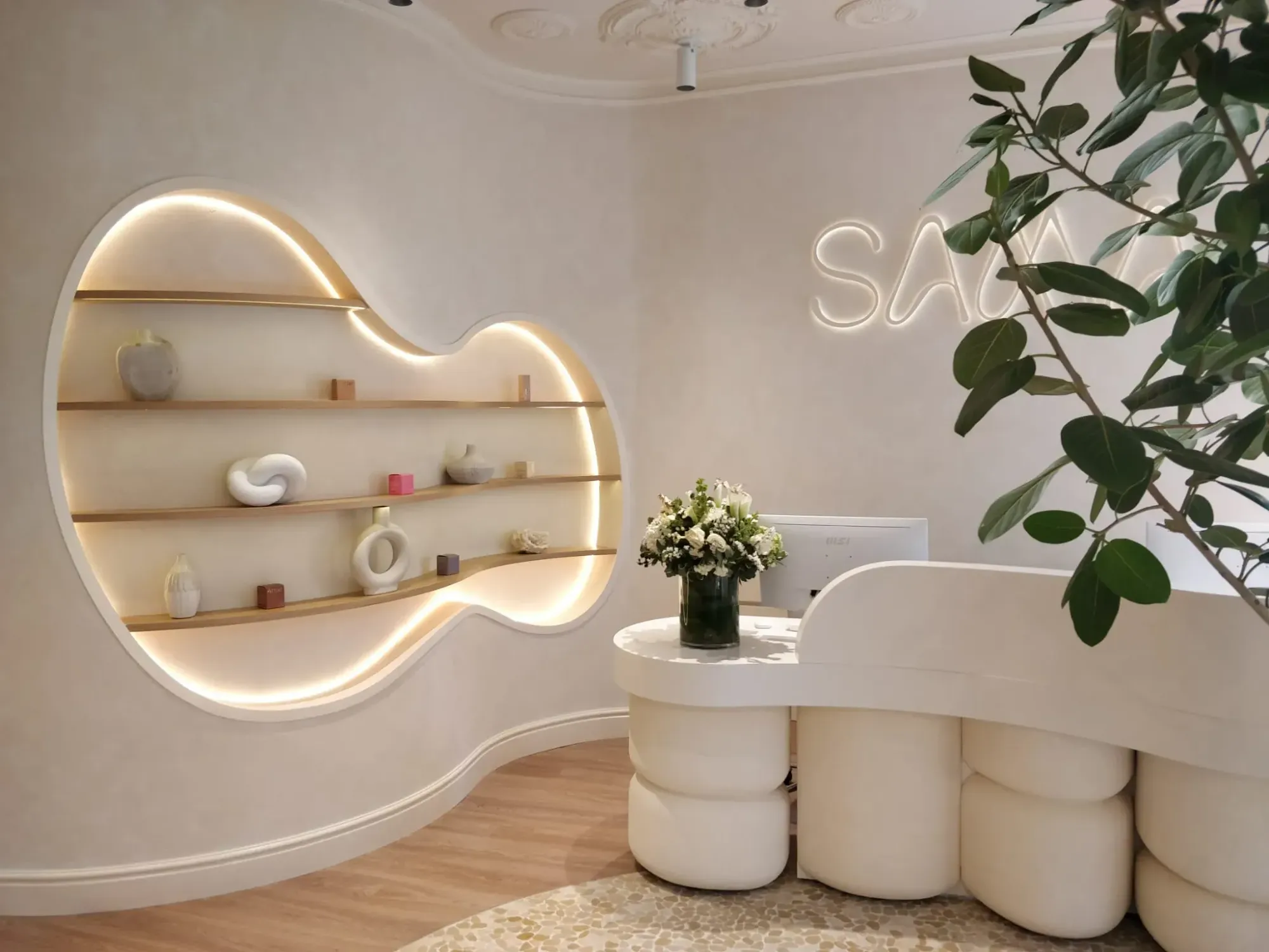 Curved shelf lobby with lights and desk