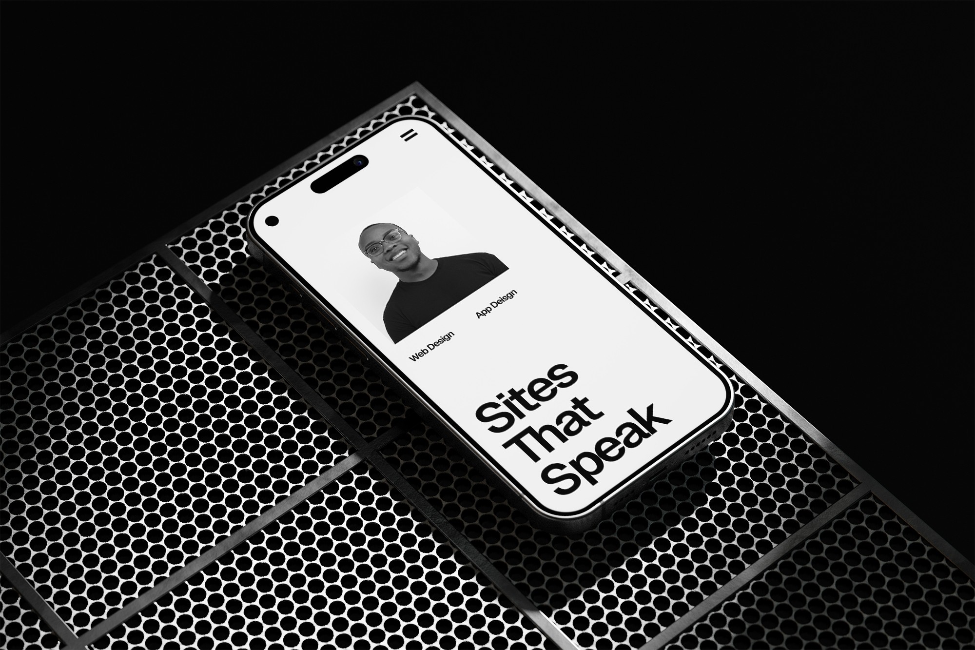 Phone on metal block, website on the screen