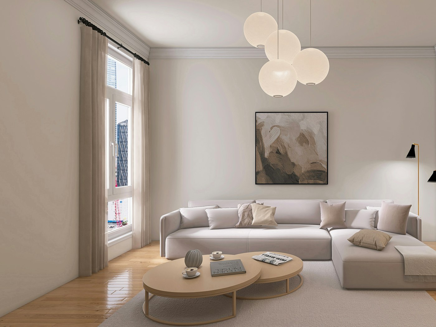 A pale living room with a low sofa and a cluster of glass globe pendants