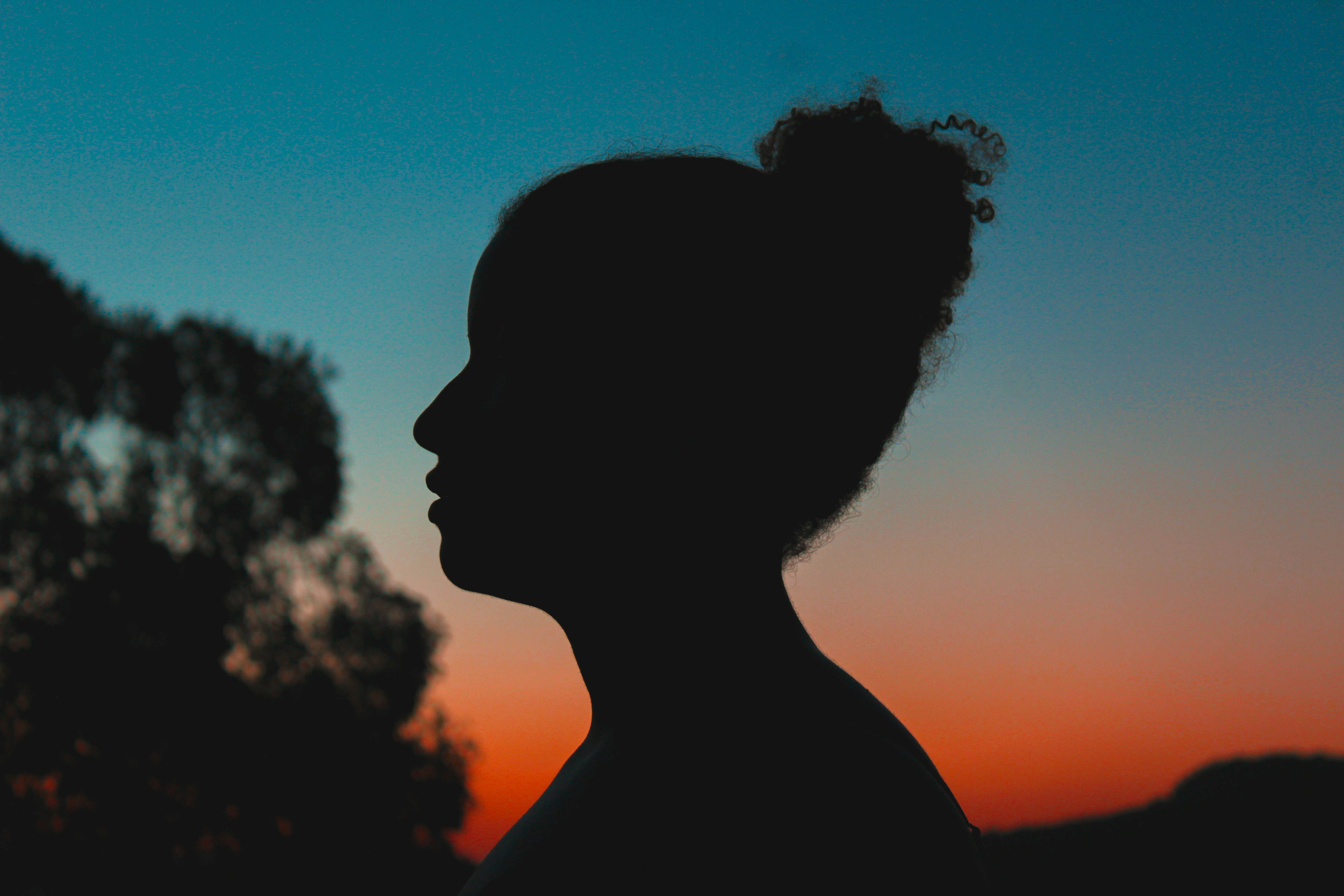 silhouette of woman during sunset
