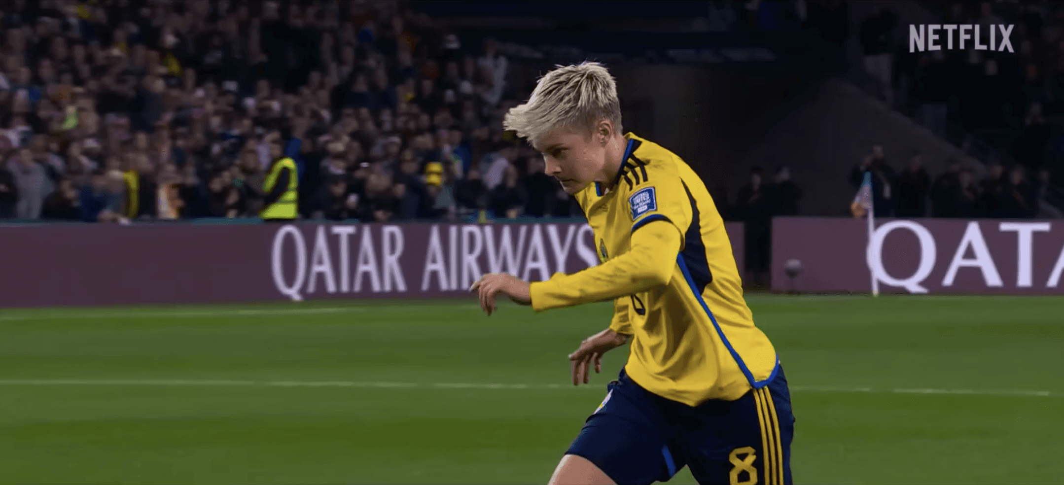 Woman about to kick soccer ball