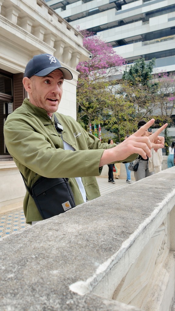 Visual designer in a minimalist studio with an iPad