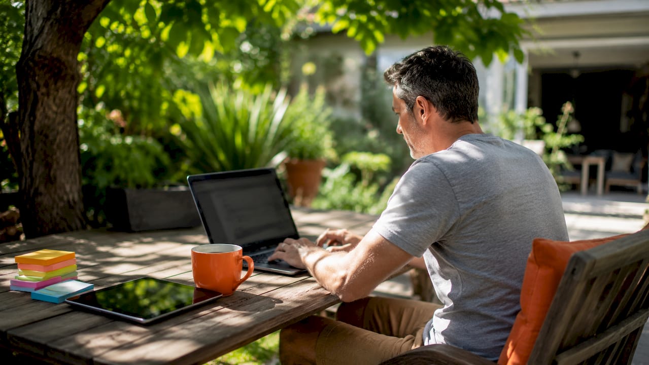 Developer working with no-code and AI tools on laptop