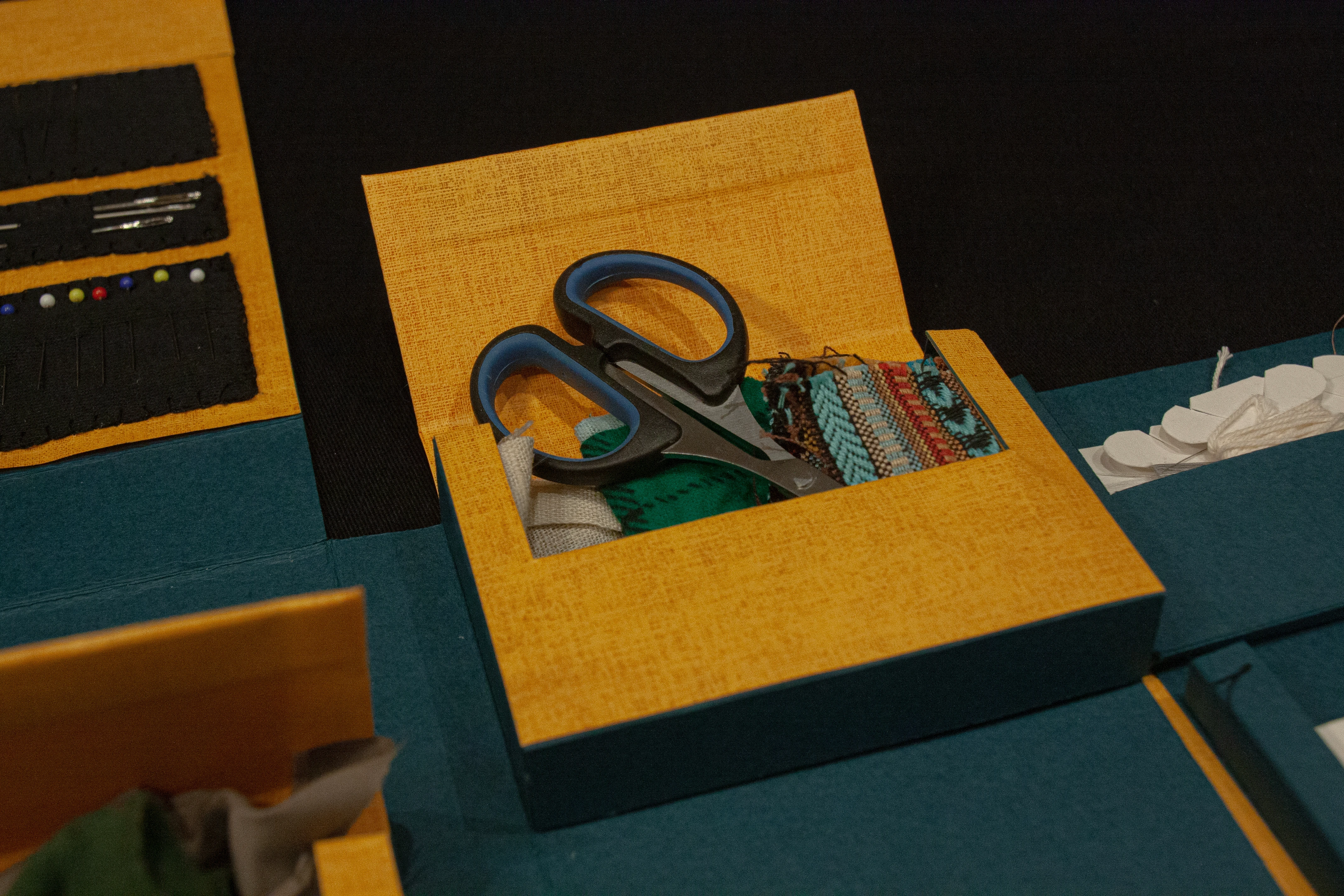 Close-up showing fabric storage in mending kit