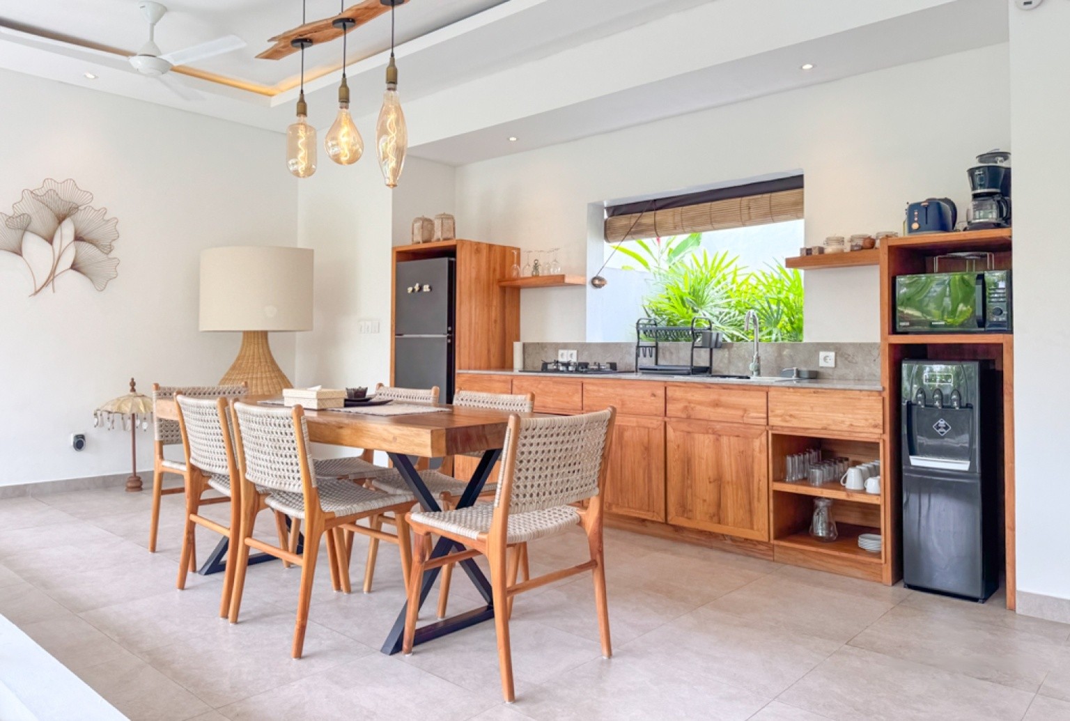 Elegant indoor dining and kitchen area at Nyanyi Beach. Discover luxury living with our real estate agent services.