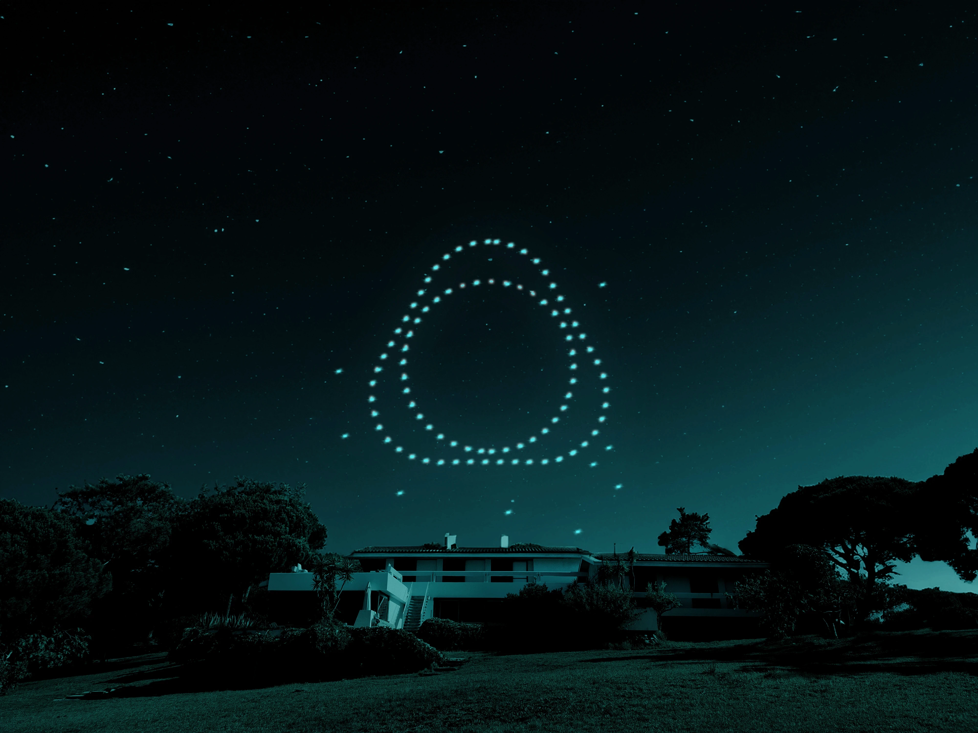 Drone light show forming the IQOS symbol in the night sky during the IQOS 10 Years celebration event in Portugal, showcasing immersive brand experience and event design.