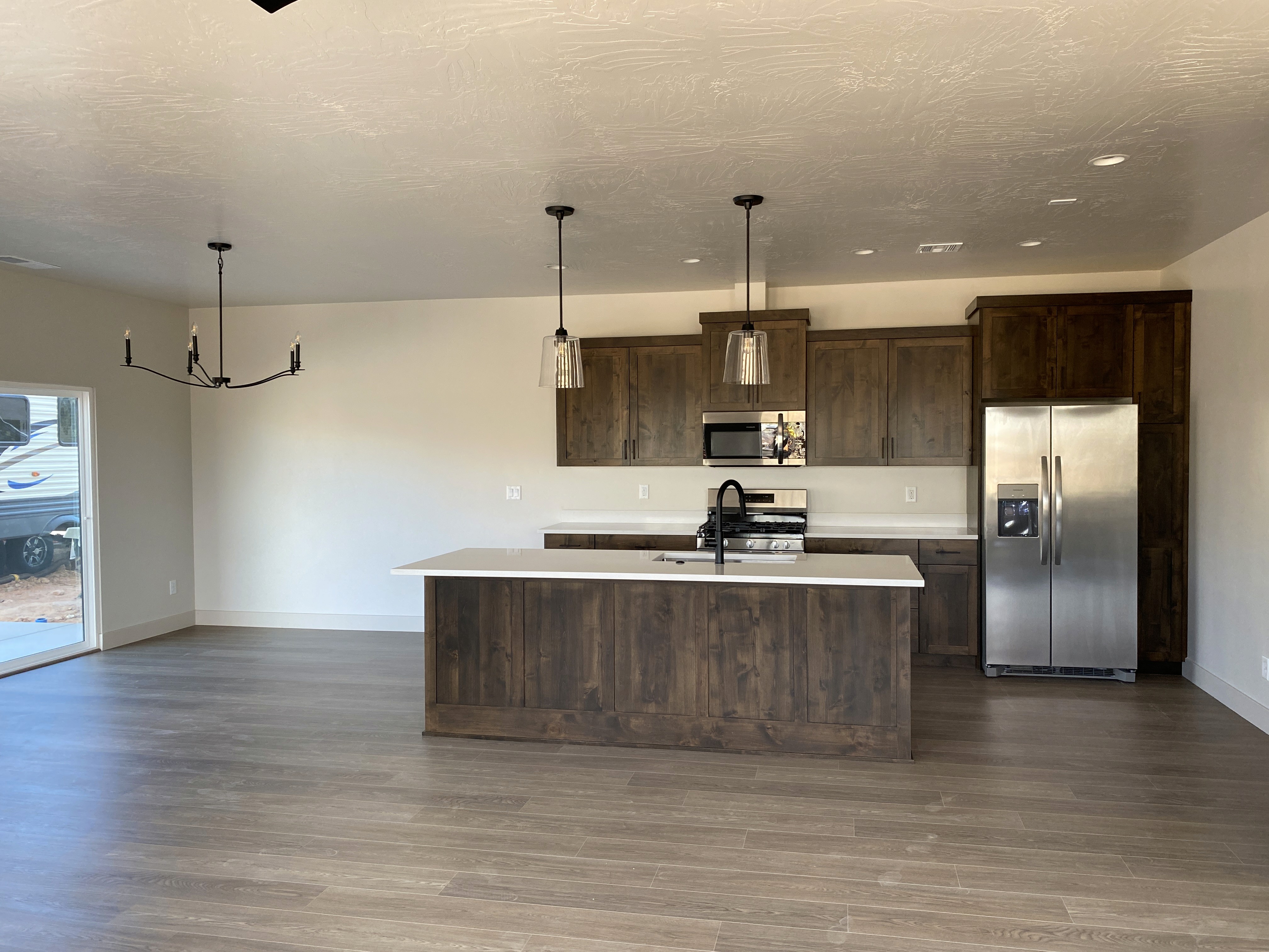 Open kitchen in a duplex home with clean finishes and functional design in a Hurricane, Utah home.