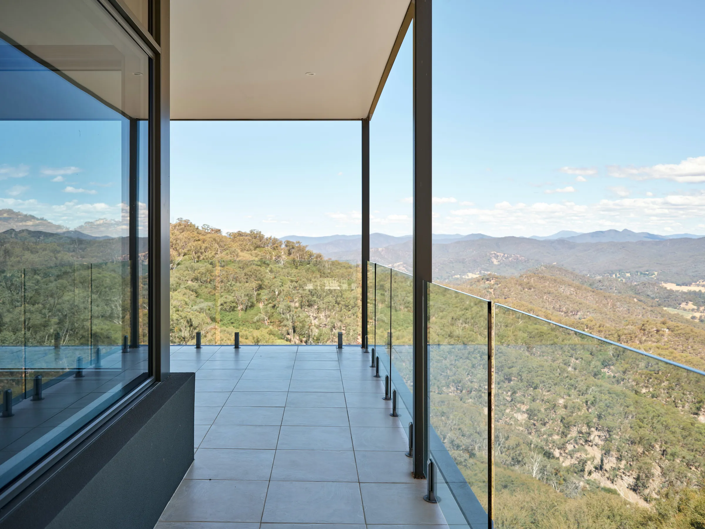 Contemporary wooden architecture featuring natural cedar cladding and floor-to-ceiling glazing