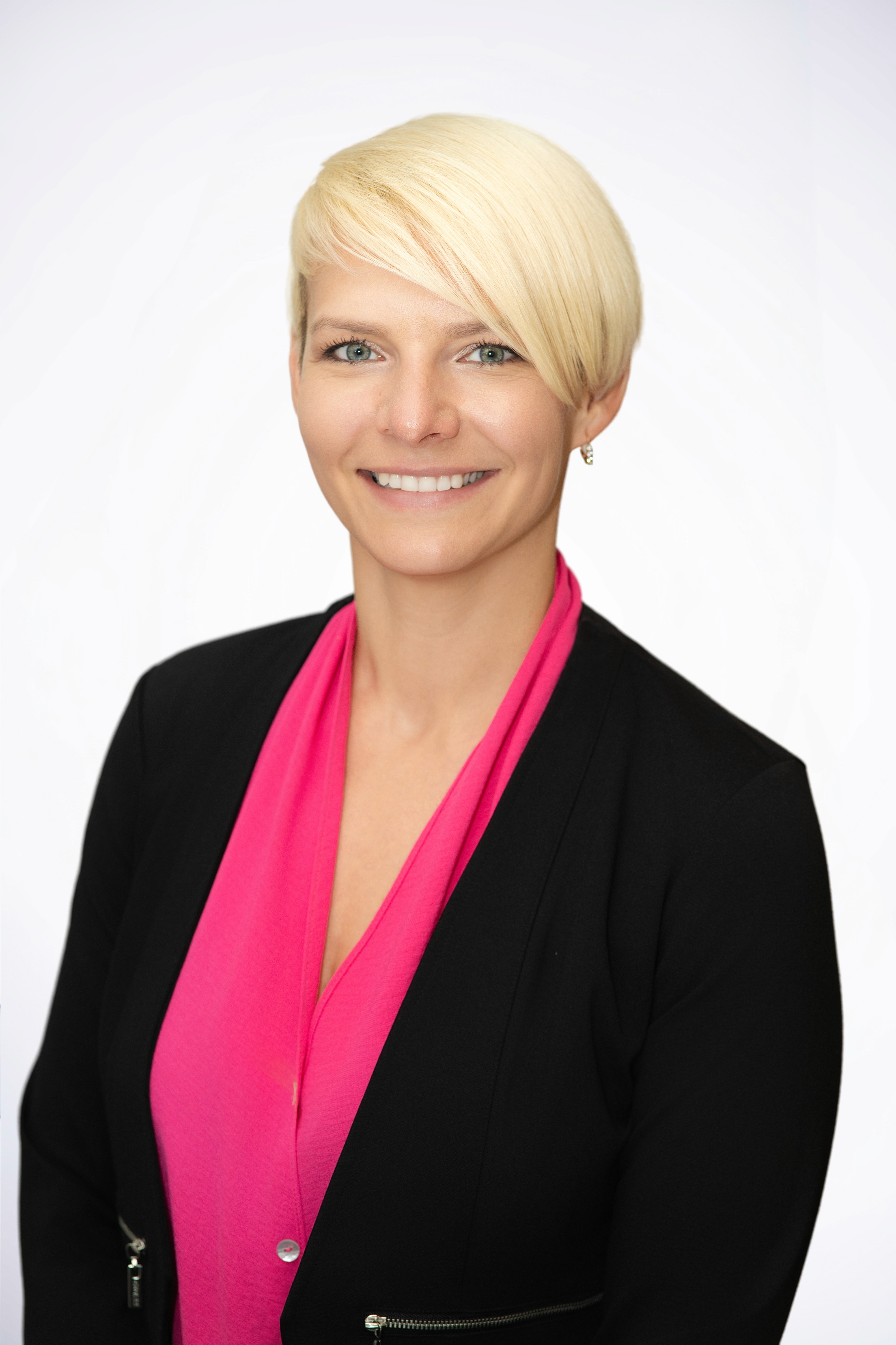 Scientist looking through a microscope in a lab.