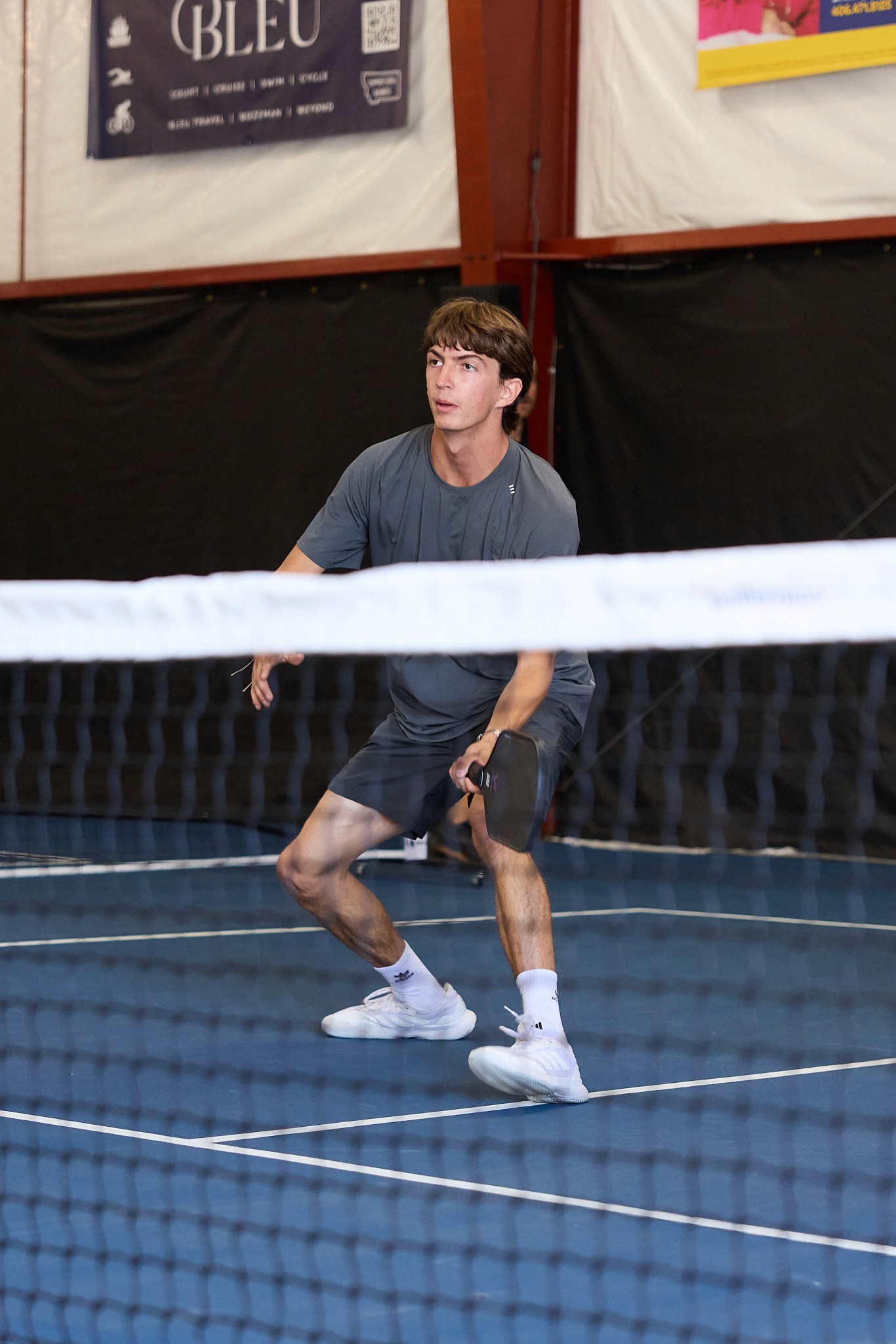 Instructor Harrison Bork preparing a shot at the net