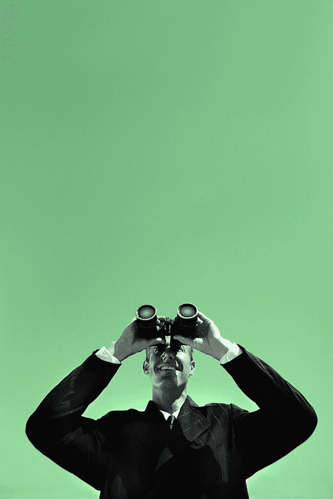 An image of a man holding a binocular