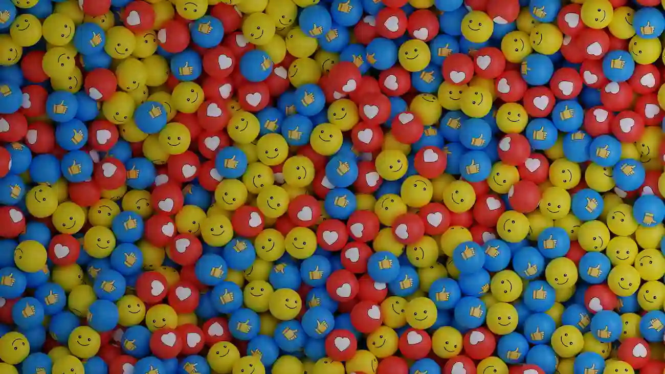 Colourful balls with smiley faces, hearts and thumbs-up icons, representing social media sponsorship, community engagement, UGC and interaction for sports clubs.