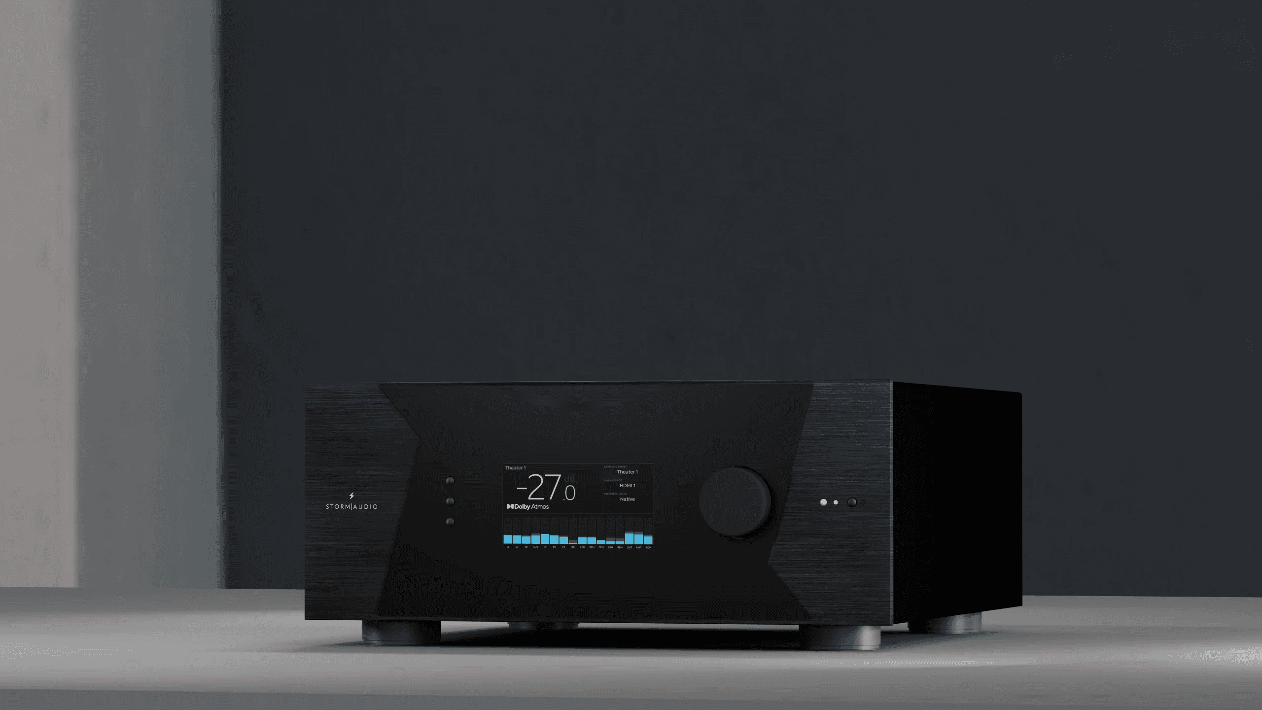 StormAudio receiver with display showing Dolby Atmos and audio levels