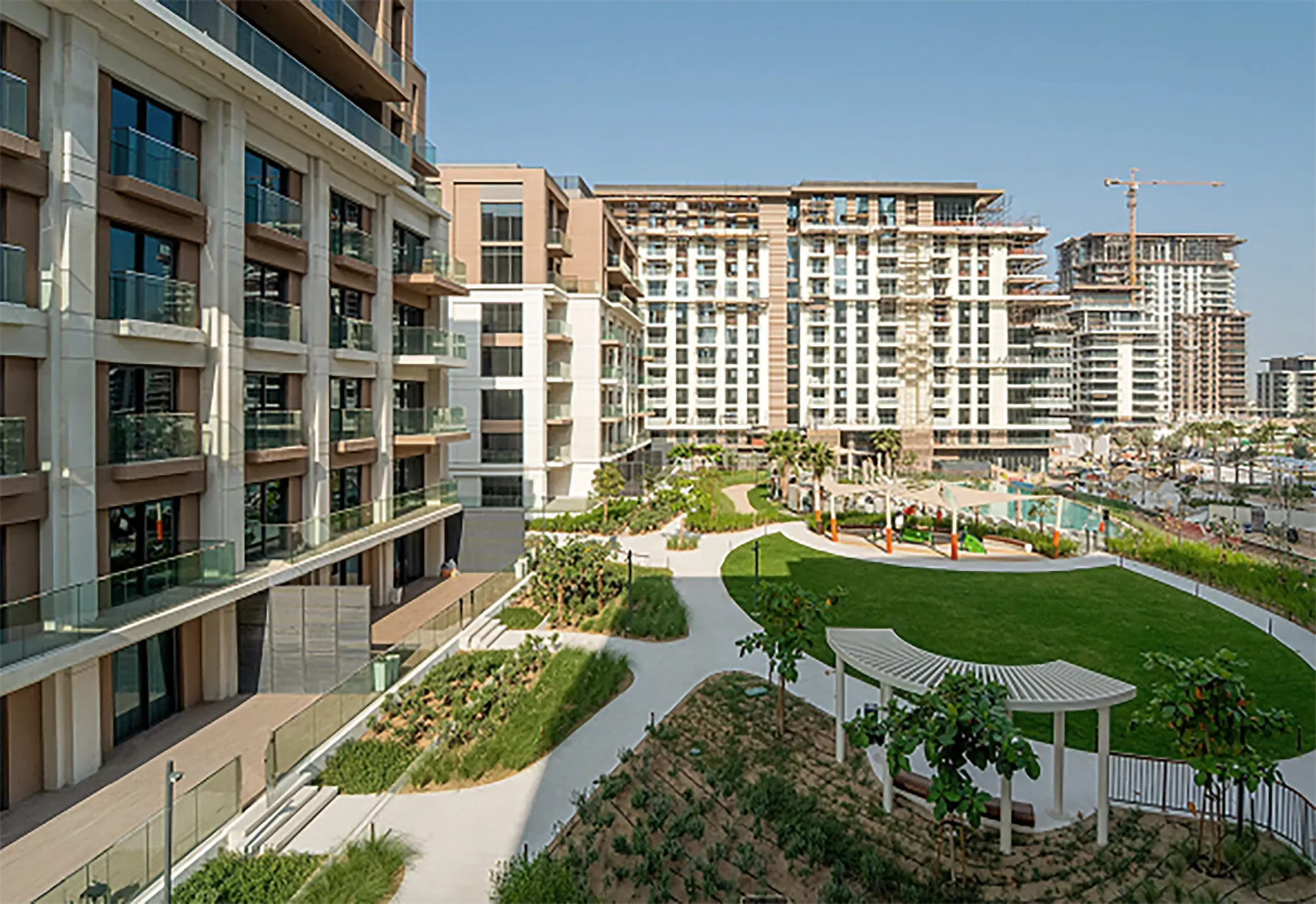 View on Dubai buildings with green scenery.