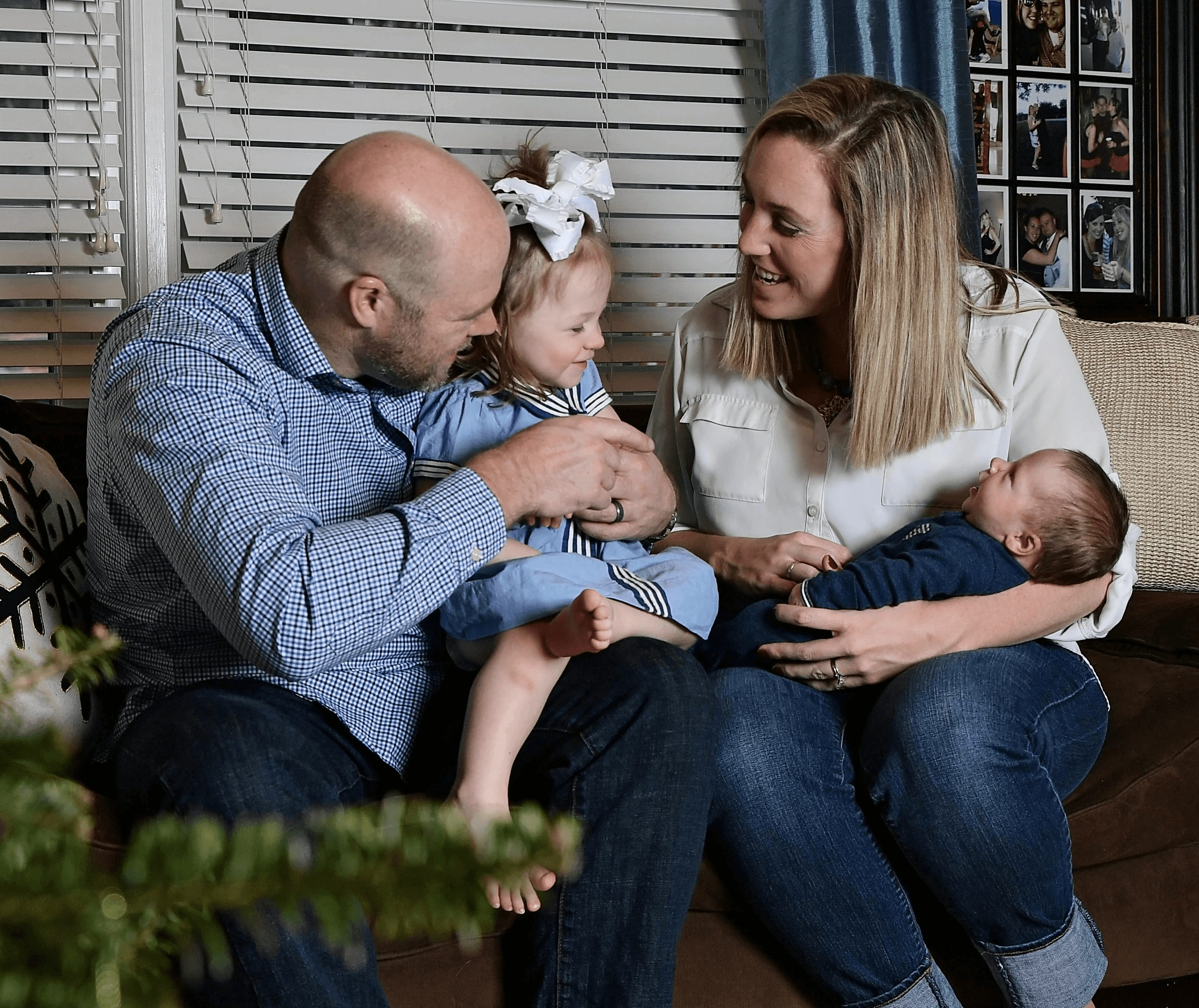 parents and young children on a couch