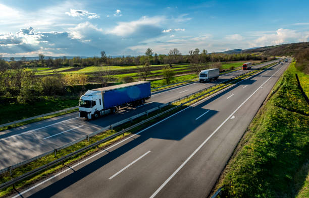 image of a blue large haulage truck driving down a uk motorway