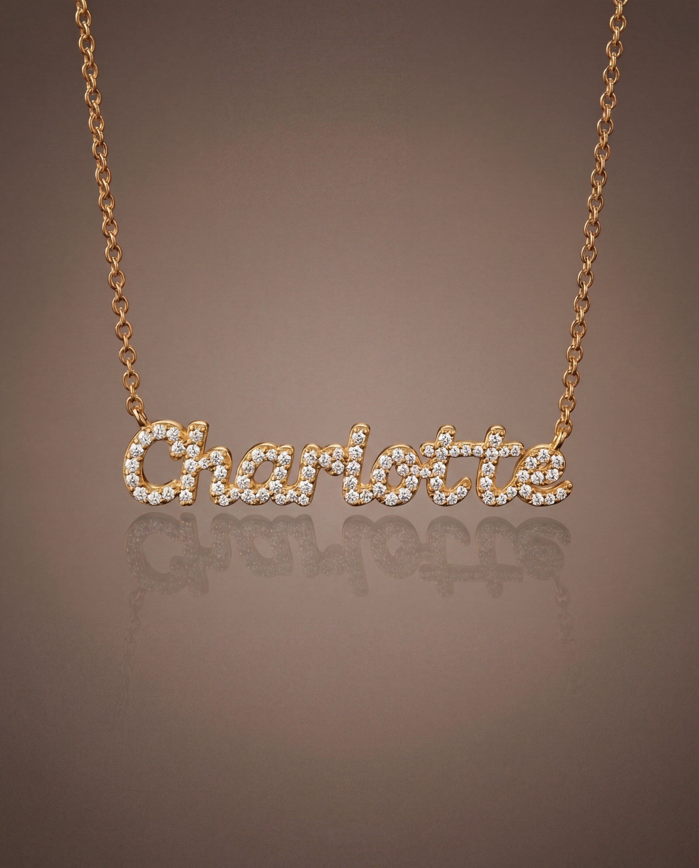 Vedder & Vedder — Charlotte pavé name necklace with a soft reflection.