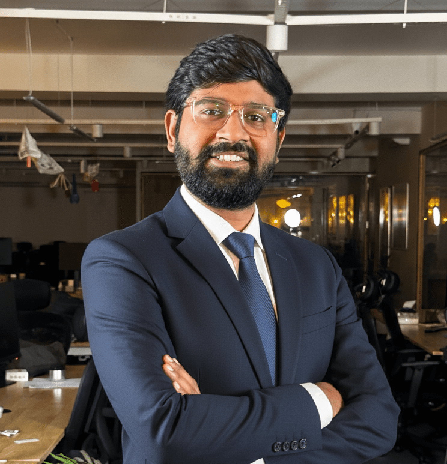 Portrait of Ashutosh Singh, Co-founder & CEO, wearing a black t-shirt with 'Follow the Leader' text, smiling against a light purple gradient background.