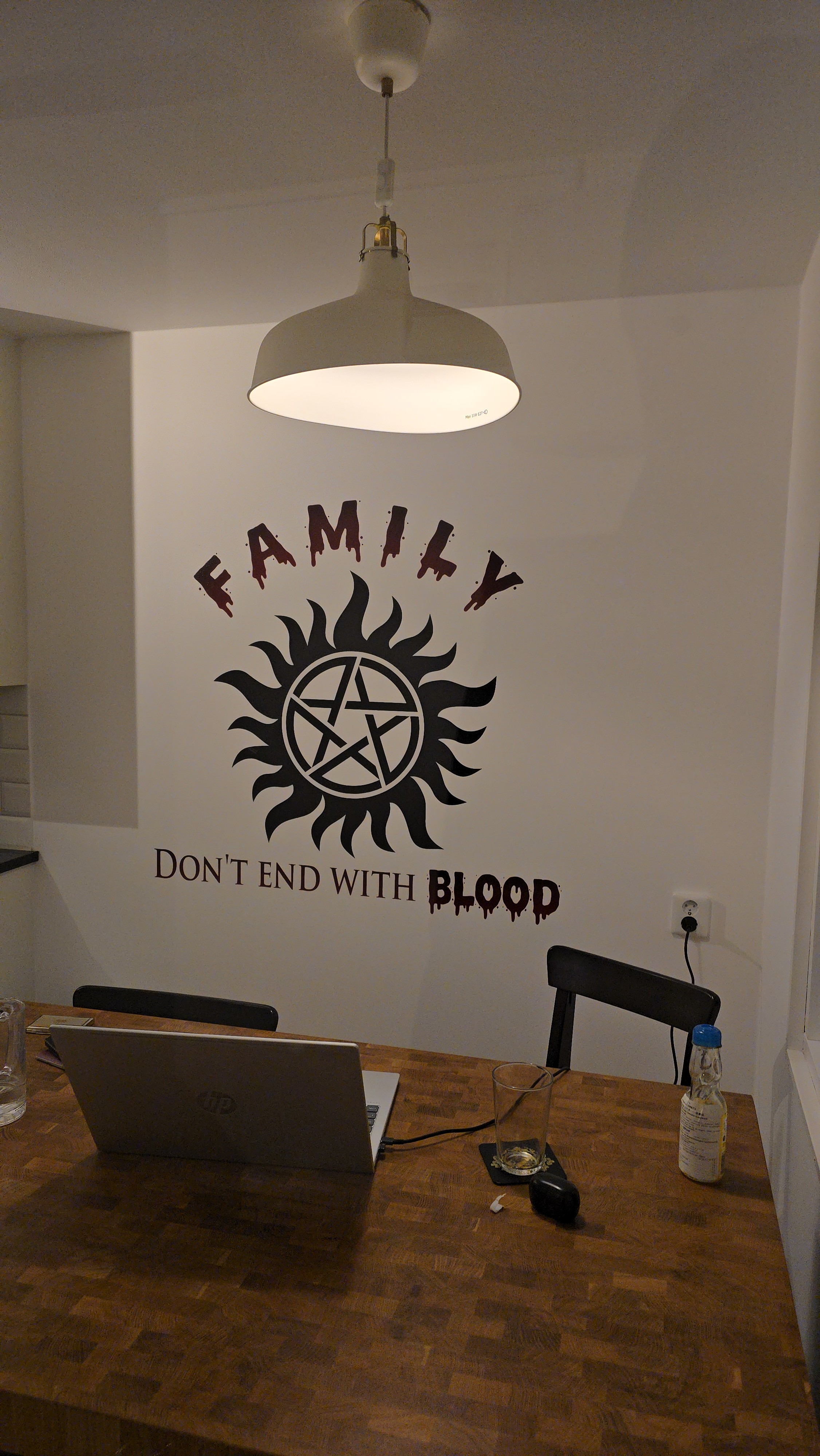 Single tree in a field with light rays.