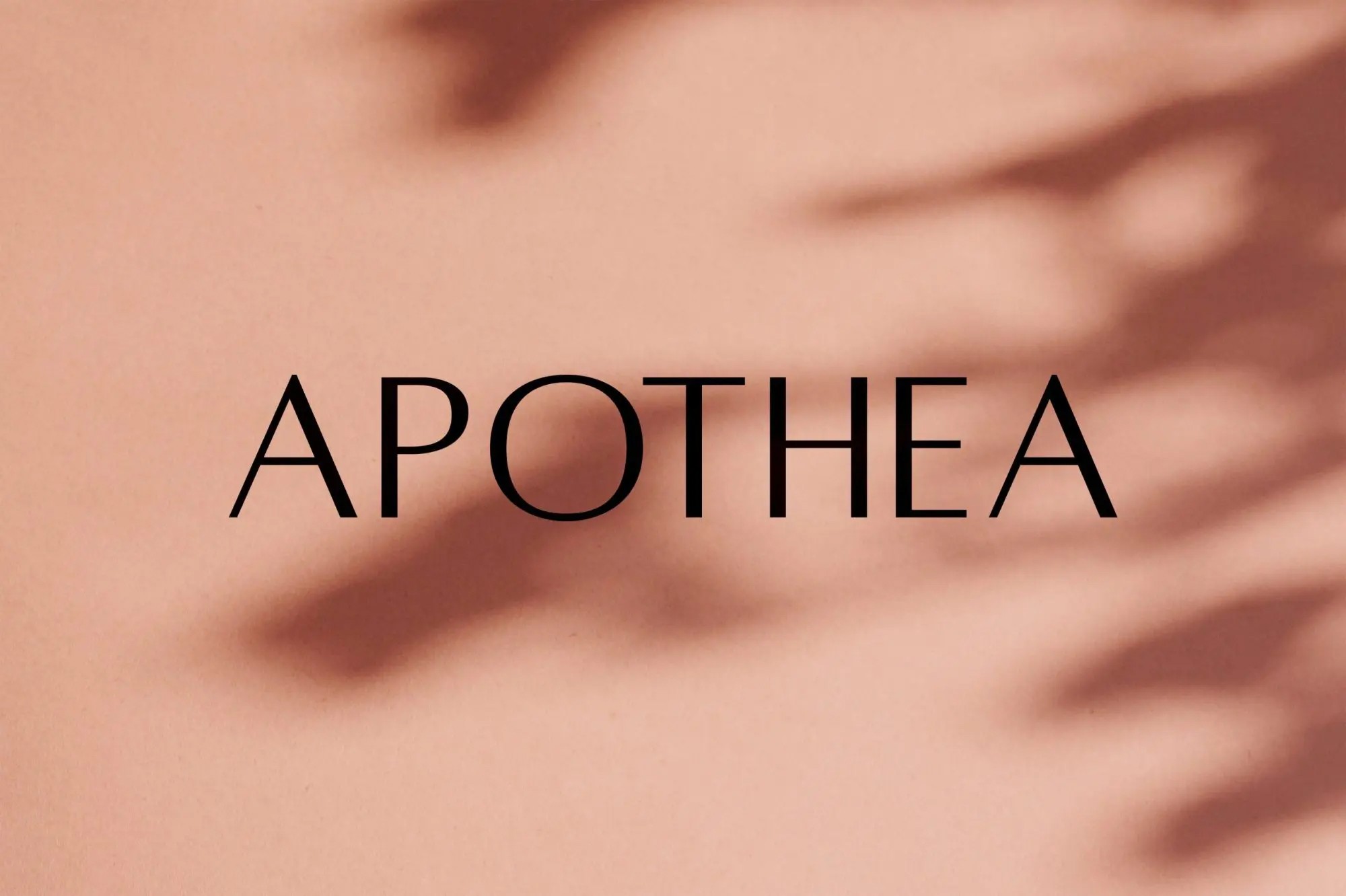 A black and white photo of a person with long hair leaning over a surfboard. The focus is on the arms and hands of the person resting on the board.