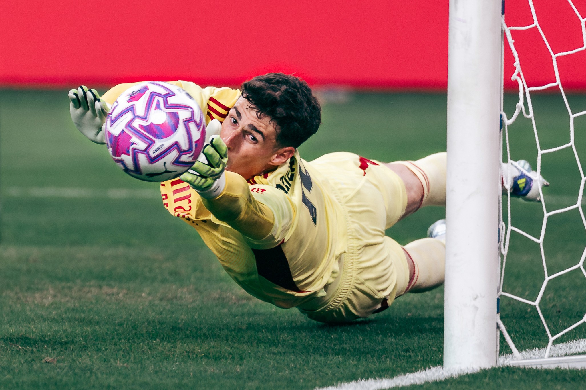 Kepa Arrizabalaga makes a save during a match between Arsenal and A.C. Milan at the National Stadium in Singapore for the Singapore Festival of Football 2025