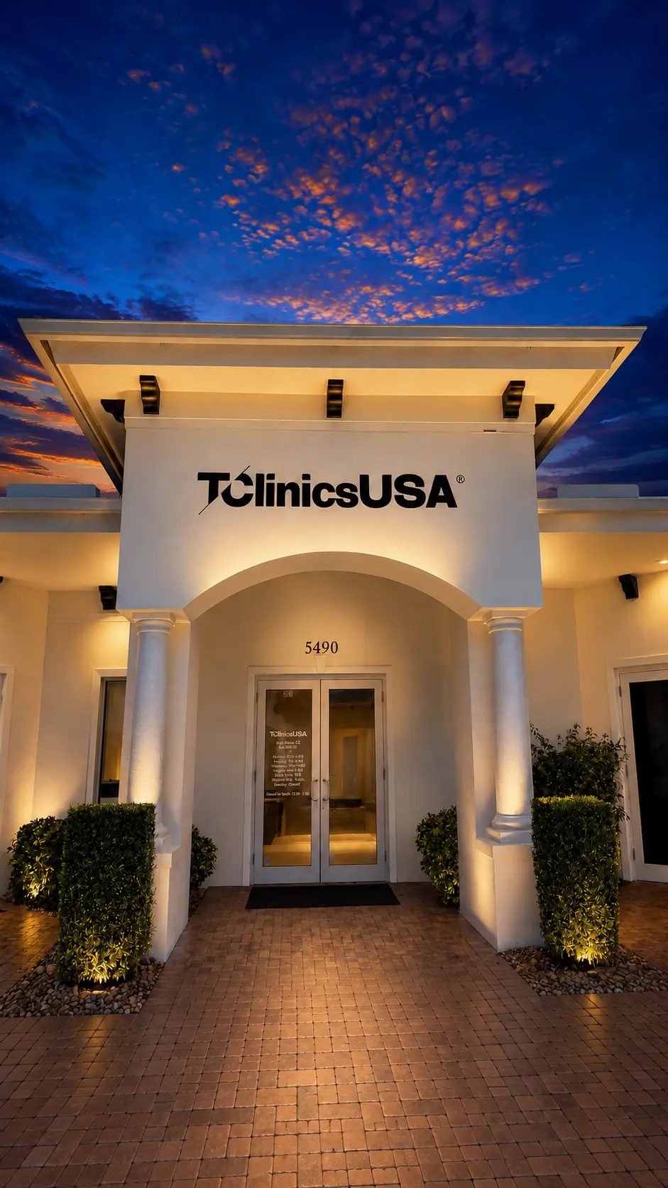 T Clinics USA clinic entrance under a blue dusk sky