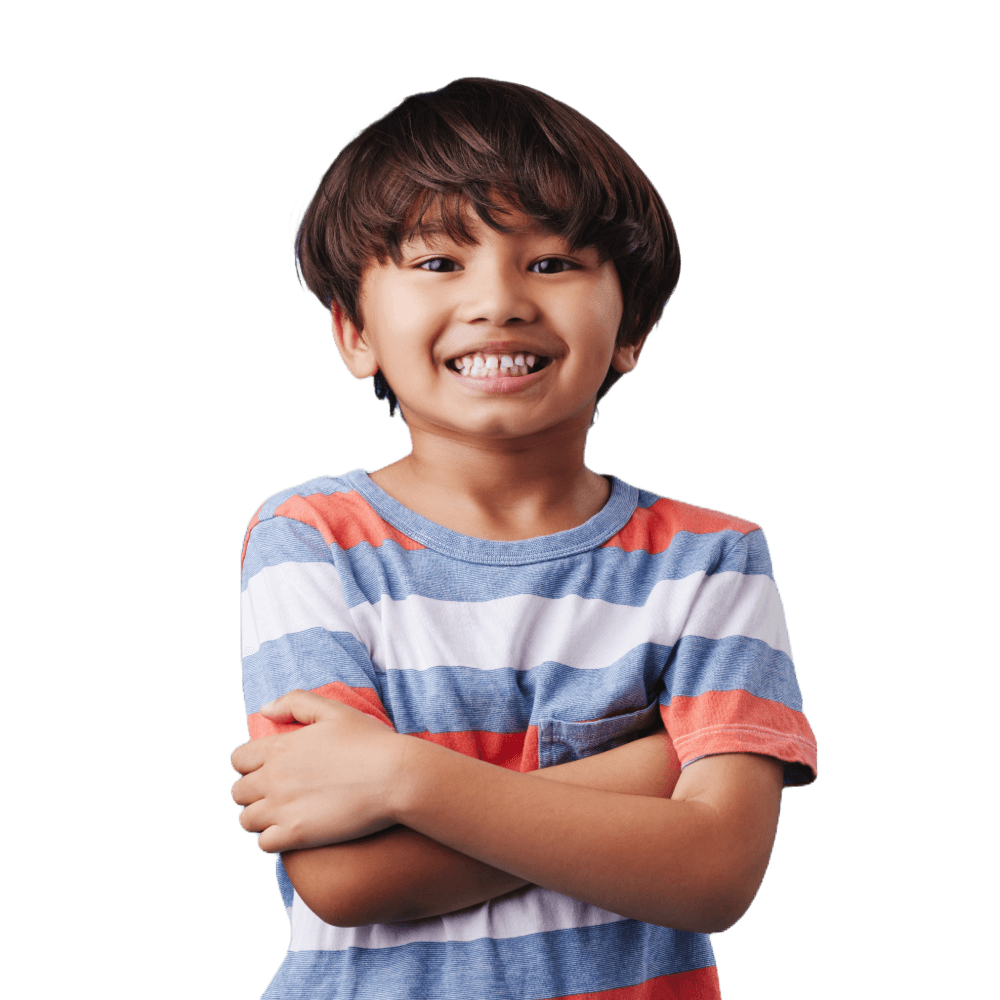 Image of young boy smiling and crossing his arms.