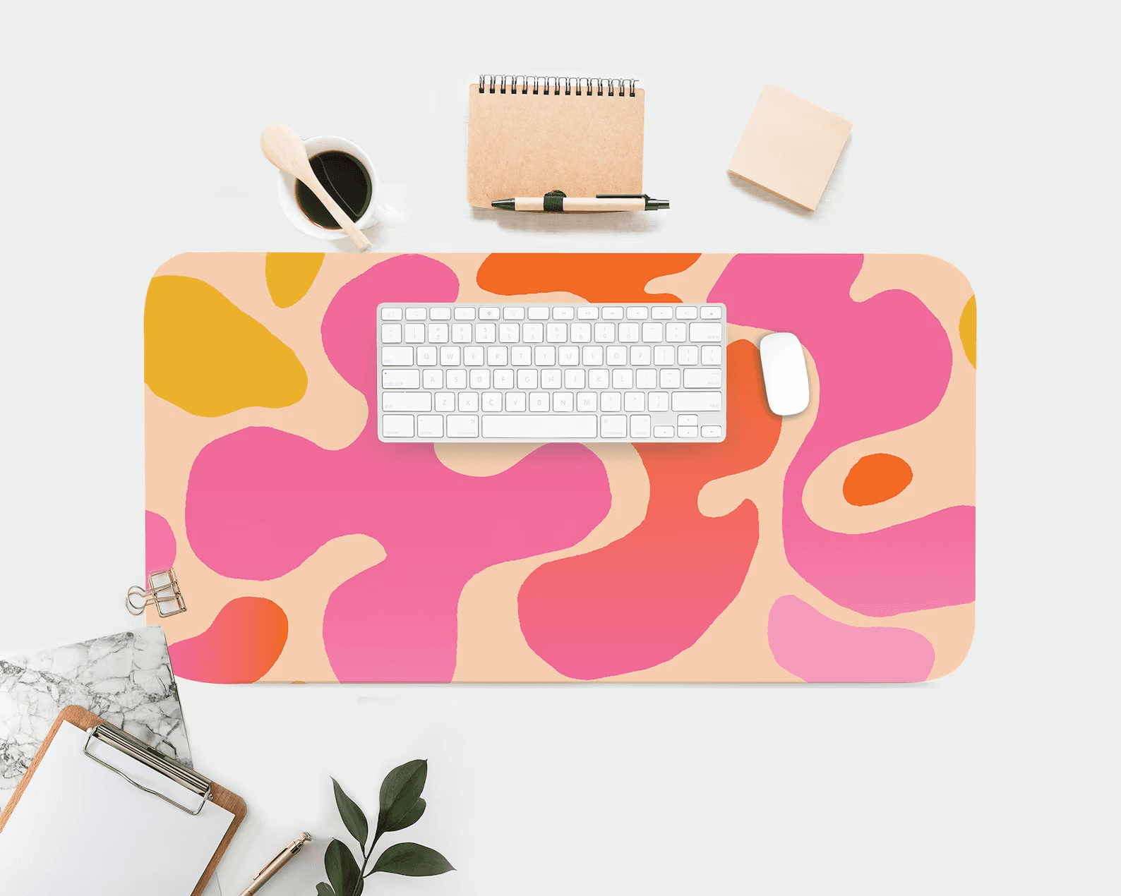 colorful desk mat with a keyboard and desk accessories