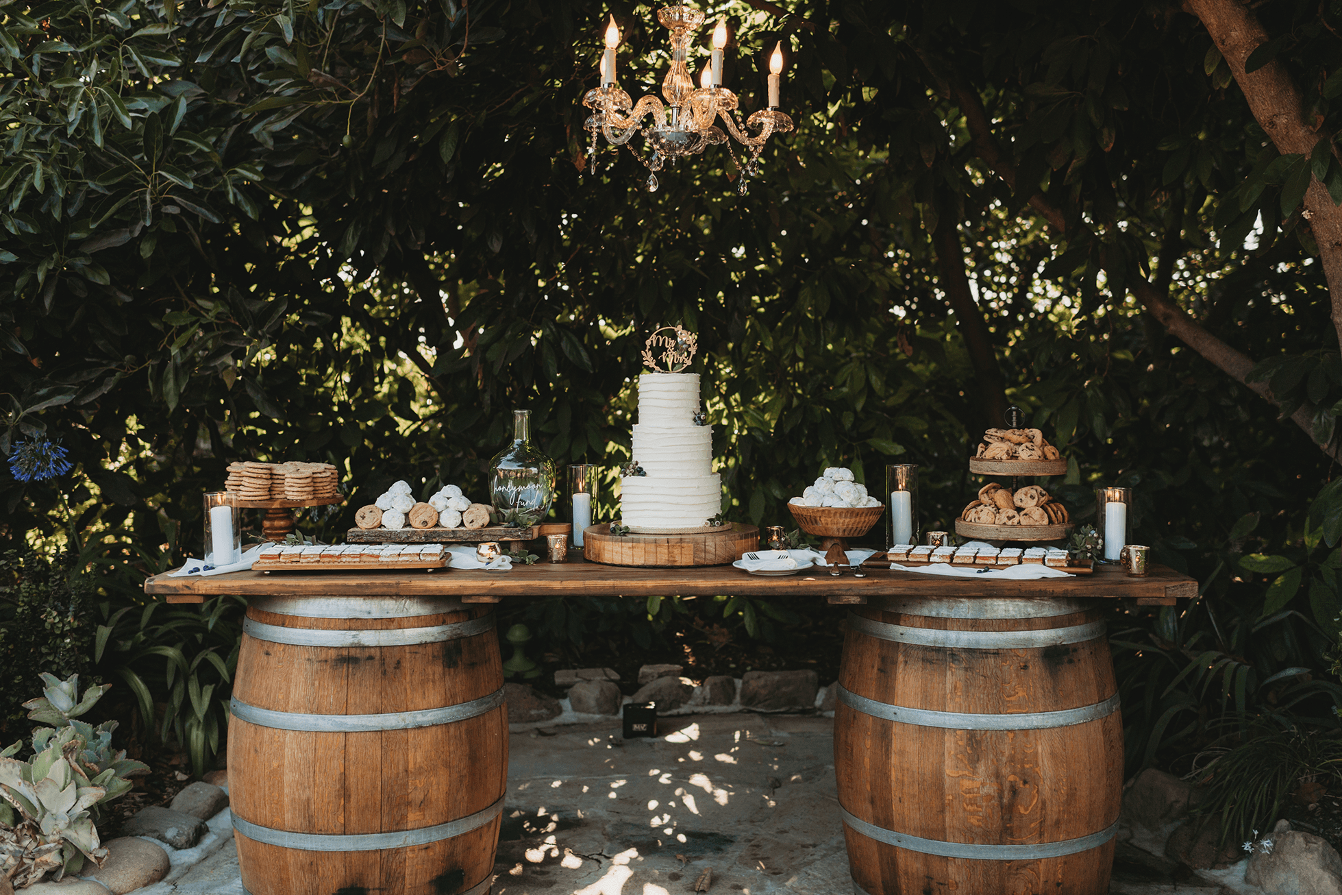 Dessert table and cake detail photo with chandelier above