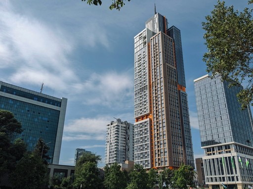 A large tall building sitting in the middle of a park