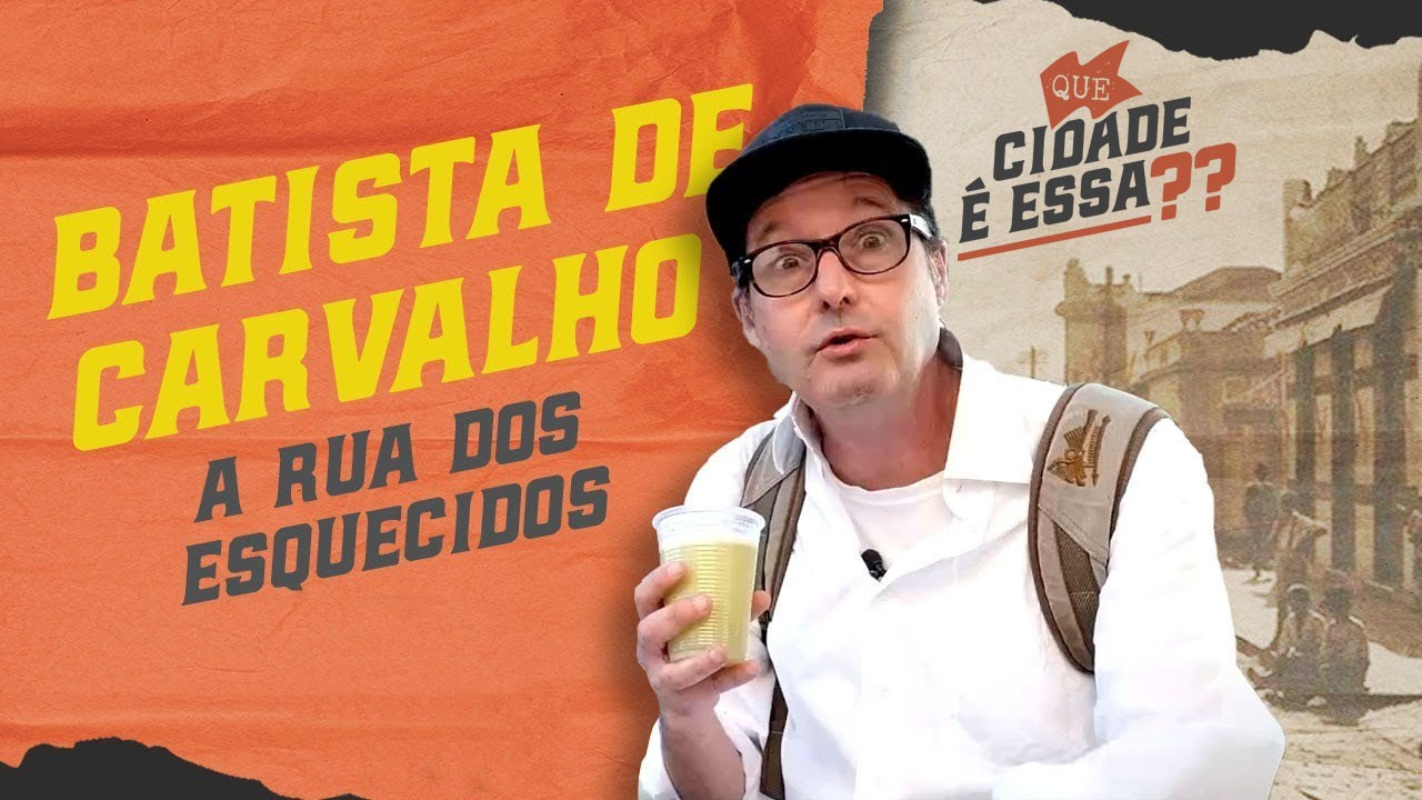 a young boy holding a box of food