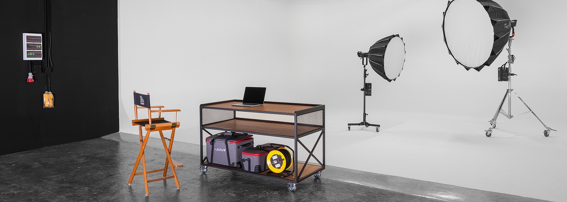 The seamless white cyclorama with a grip cart and two large softboxes at MStudio Asia in Phuket