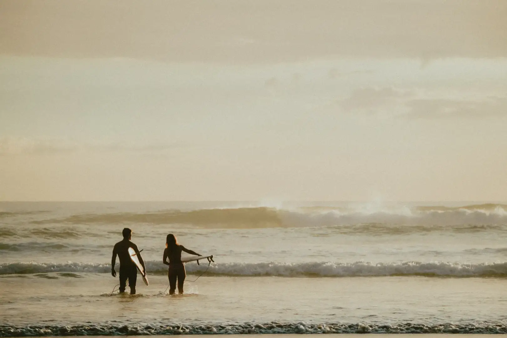 Surfboards with beers on them.