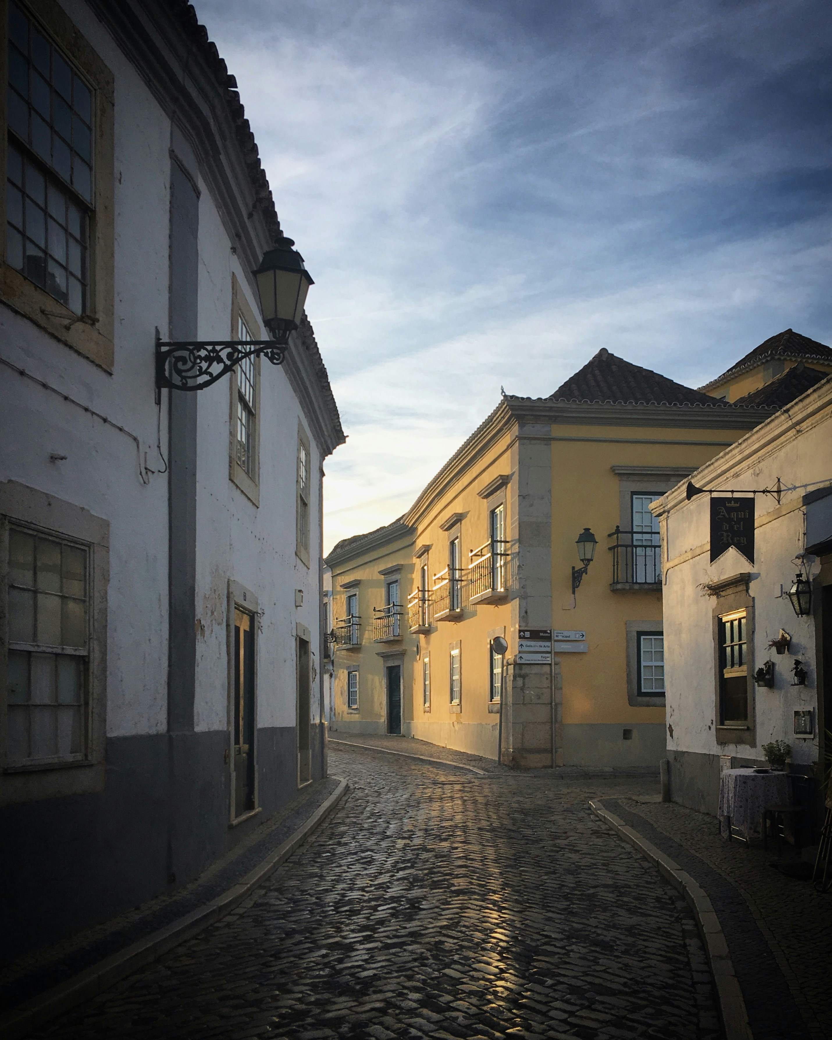 a cobblestone street in a small town