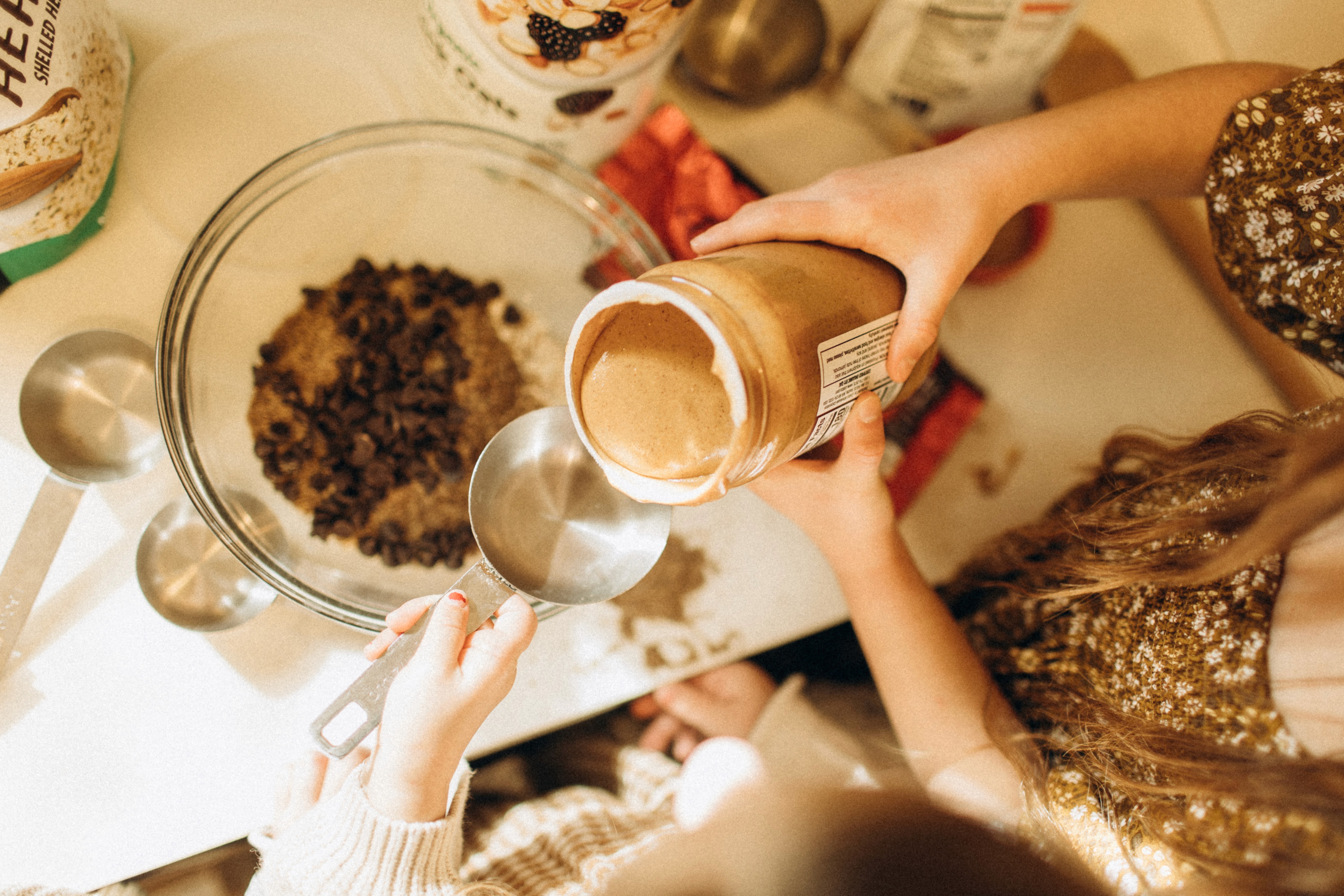 Hands preparing ingredients on the kitchen counter during a relaxed Day-in-the-Life session.