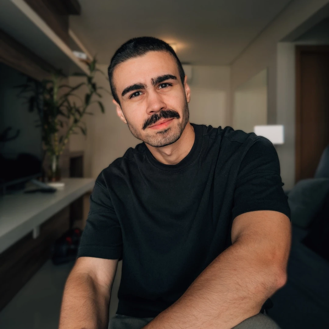 Side shot of a aman wearing a cap with the sun setting in the background
