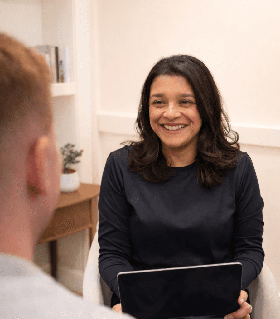 Dr. J meeting with a patient during a one-on-one appointment at Harper Health.
