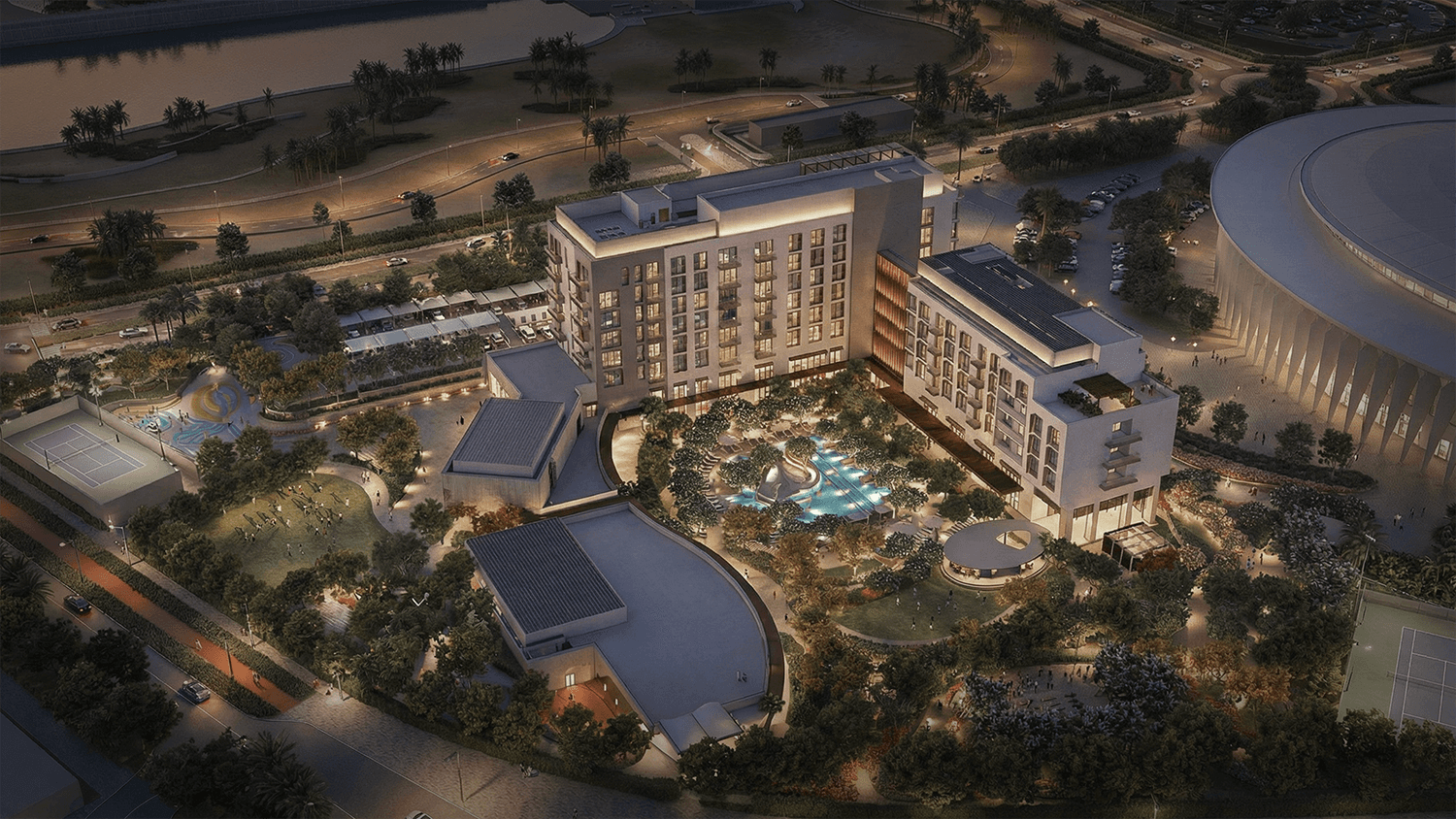 Aerial render of building complex, at twilight near a body of water