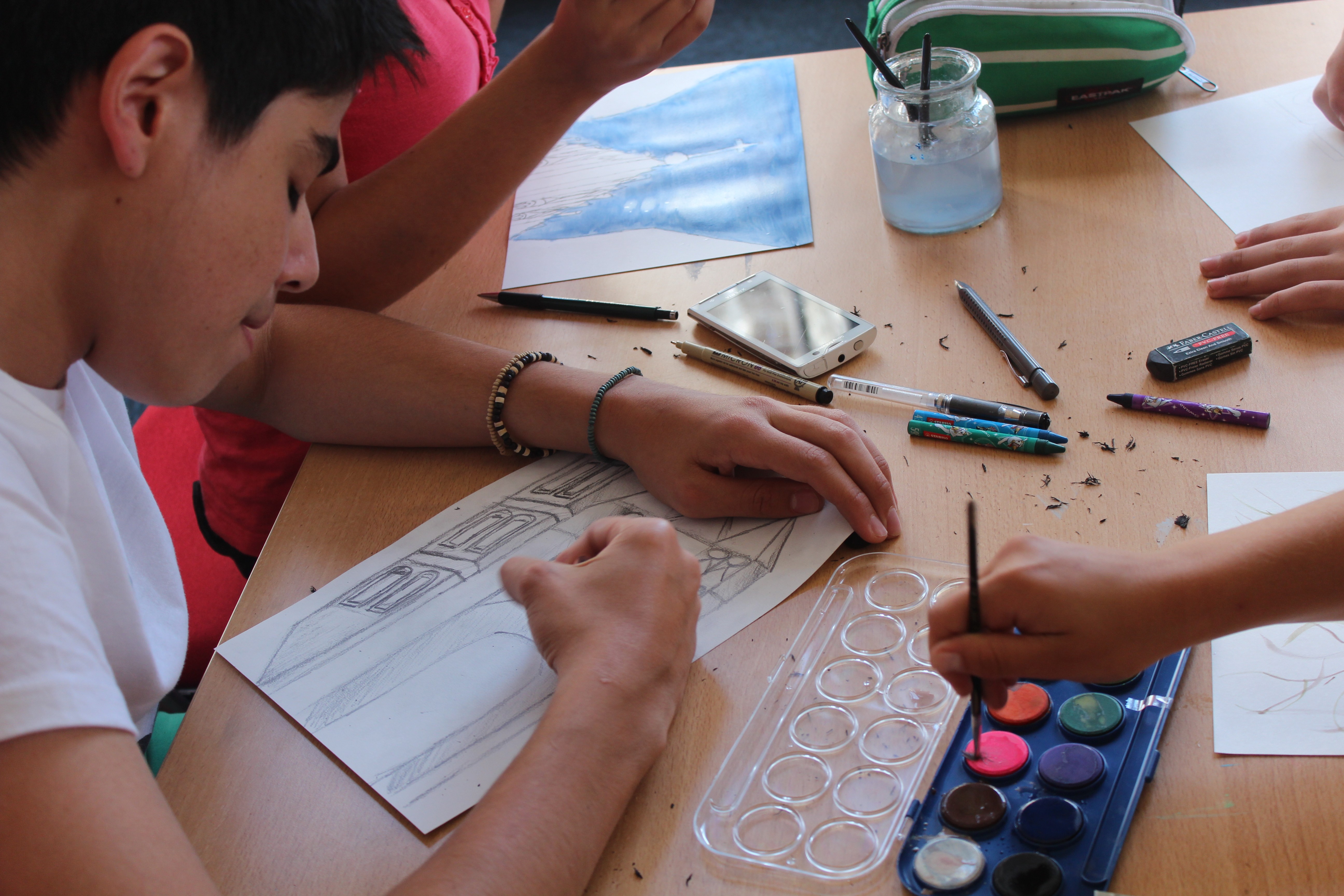 a lighthouse on a cliff by the ocean