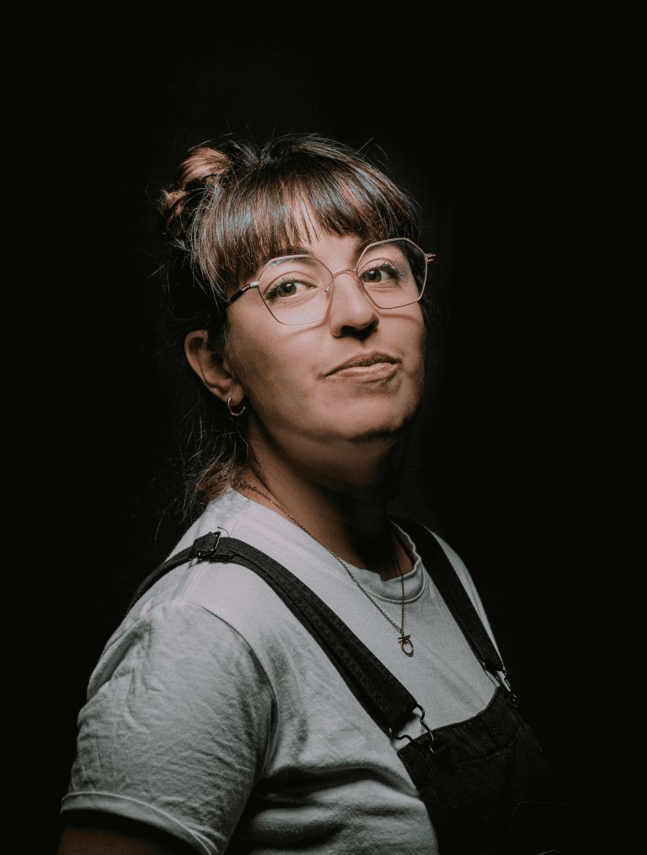 Portrait of a bartender pouring a cocktail