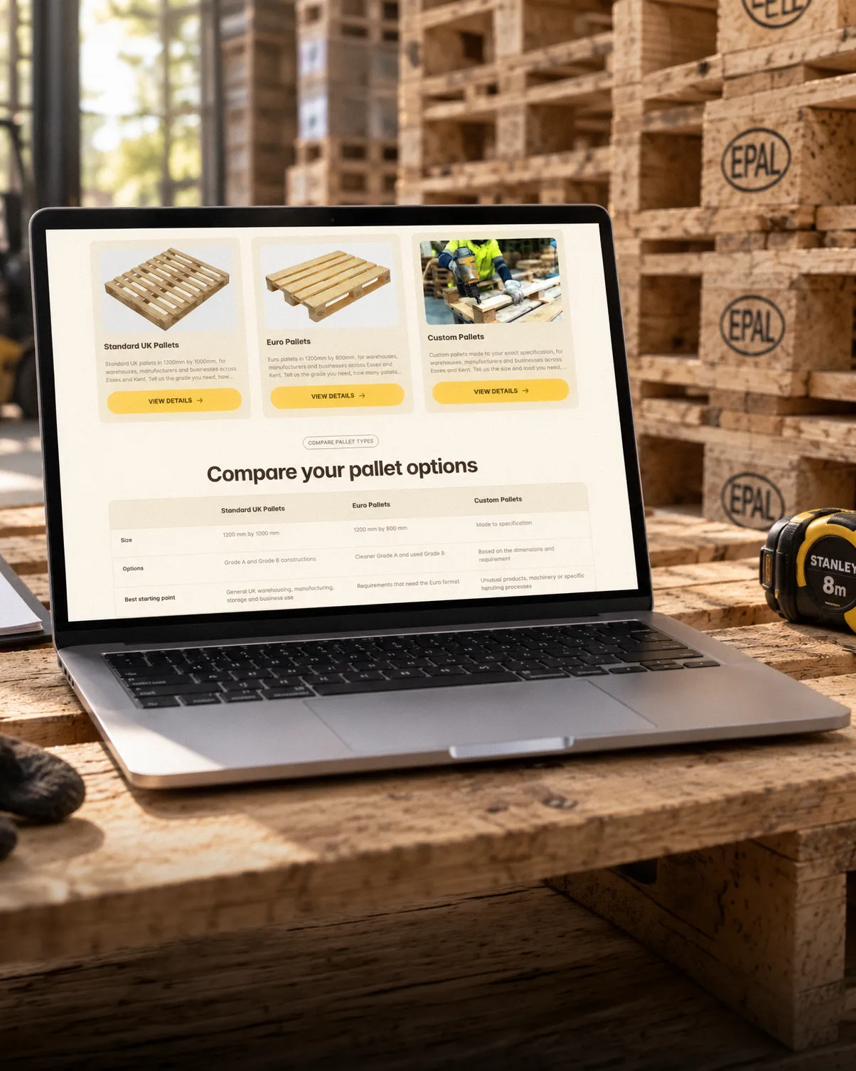 Your Pallets sales page on a MacBook Pro in a warehouse setting