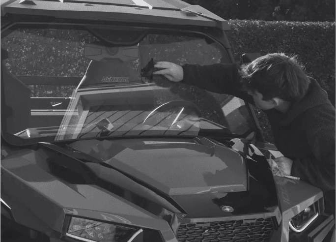 Spacious open-plan office with rows of desks and striking circular ceiling lights.