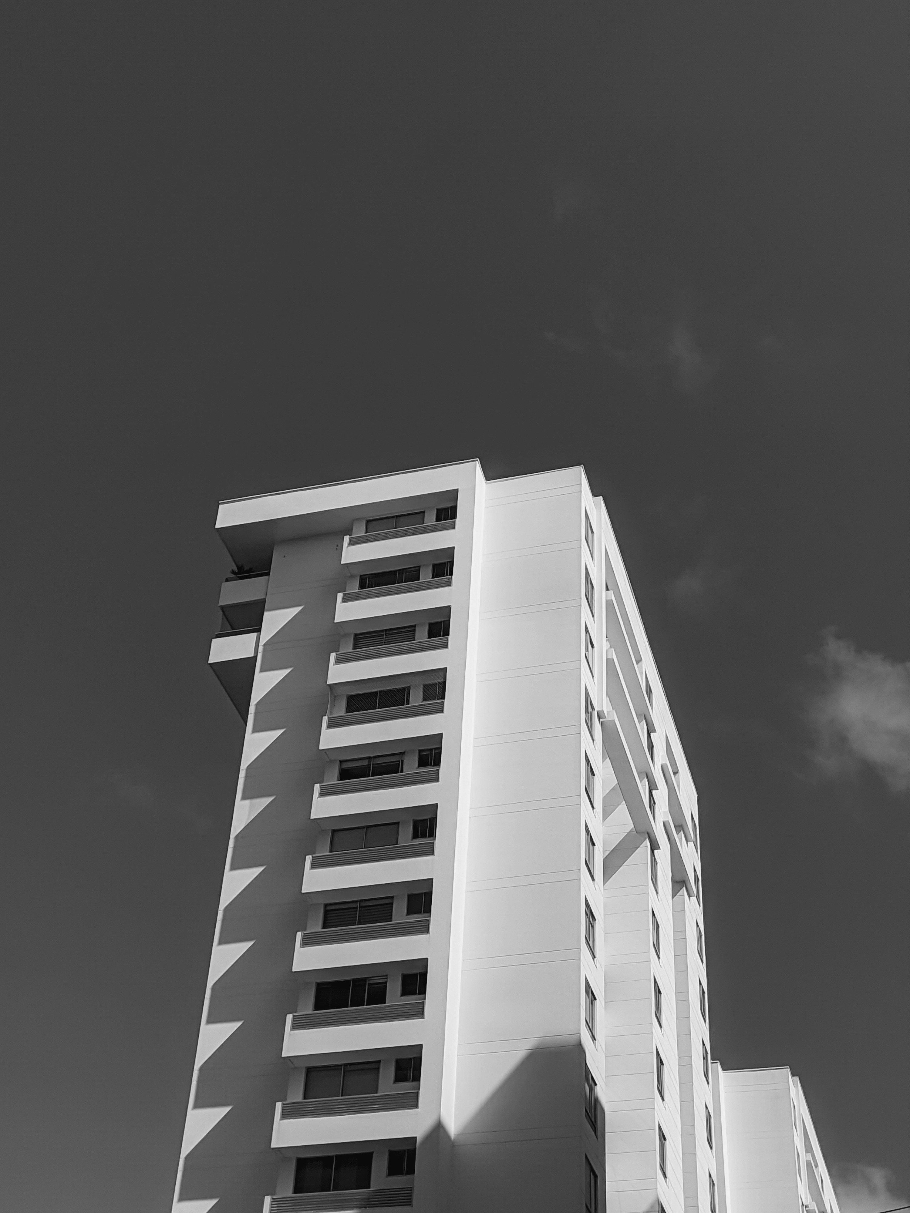 a black and white photo of a tall building
