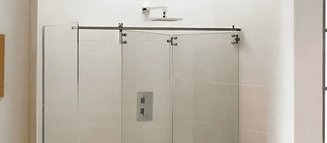 man wearing gray polo shirt beside dry-erase board