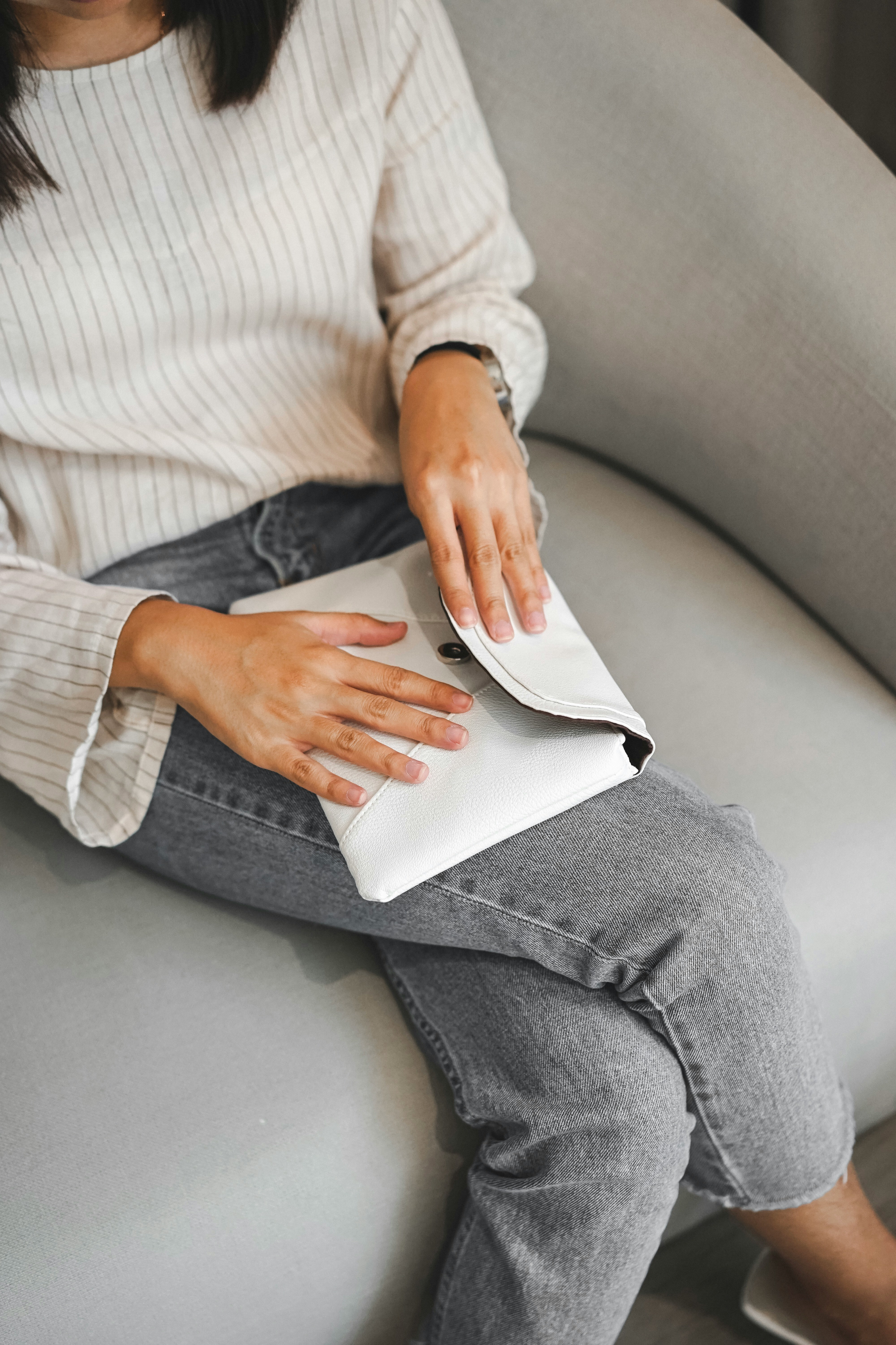 women about to close envelope clutch