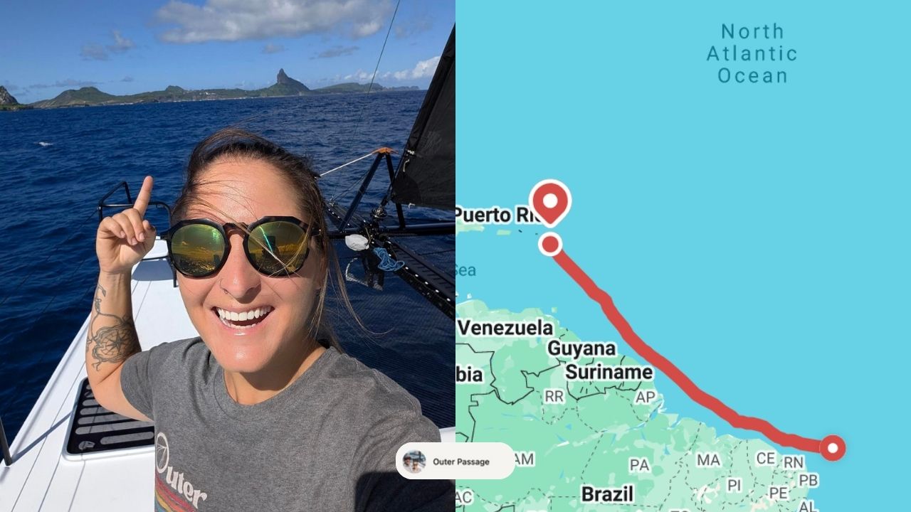 A woman on a catamaran spots land while crossing from Fernando de Noronha to Antigua.