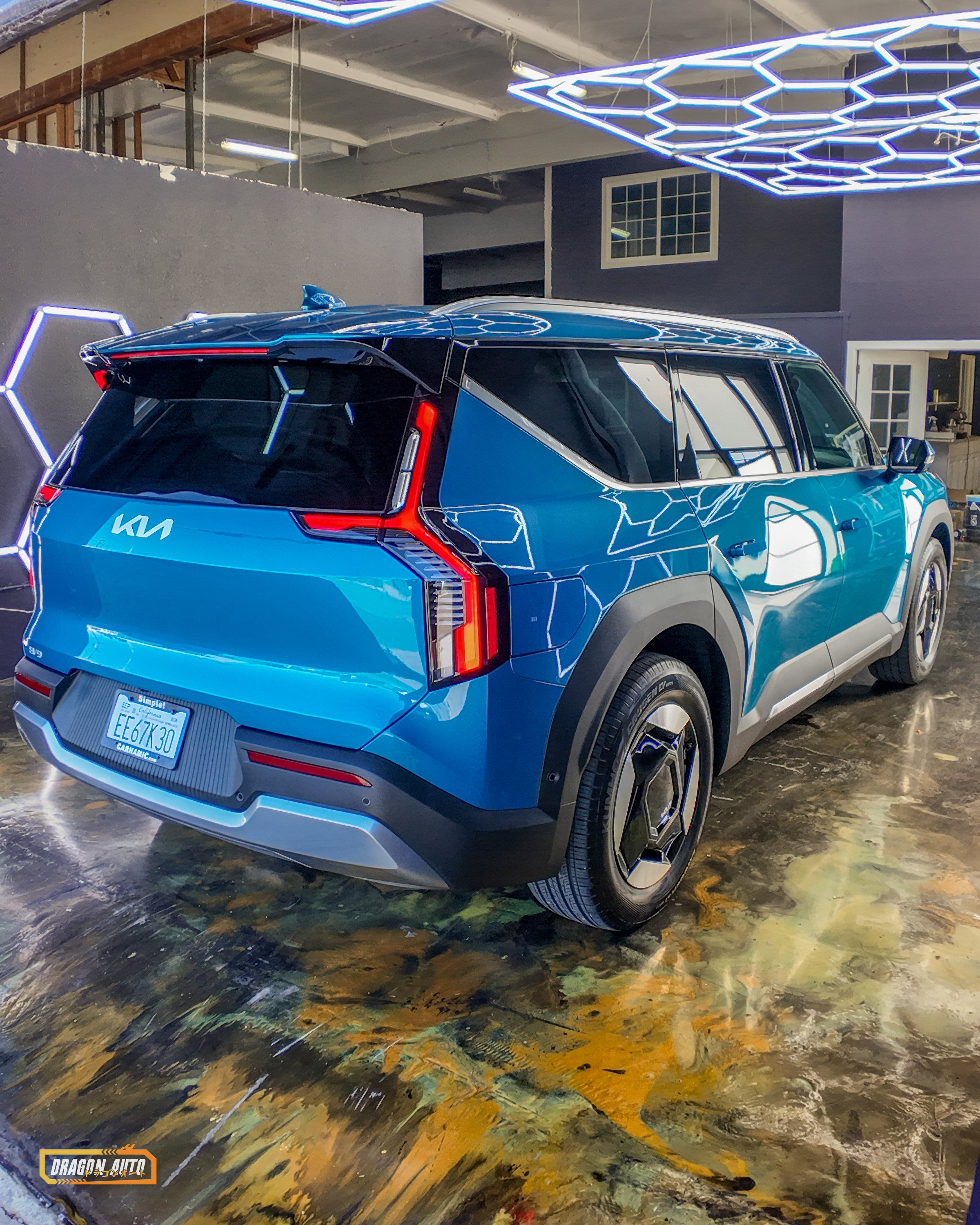 Blue 2026 Kia EV9 with Icon Rocklear paint protection, rear 3/4, wide, vertical, Dragon Auto Milpitas